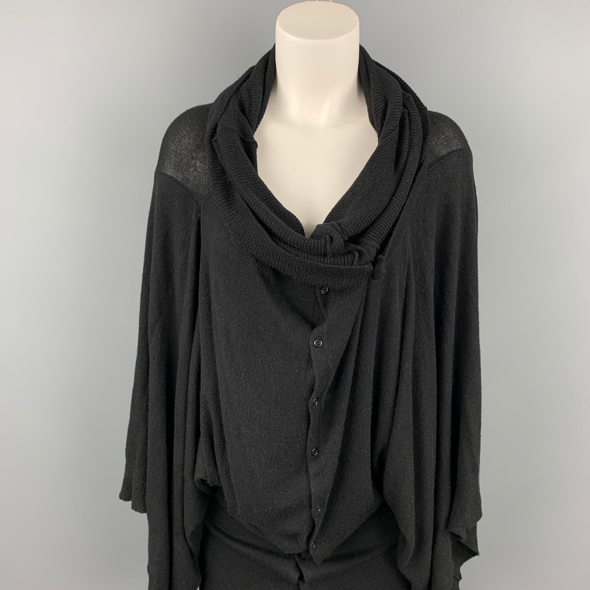 A.F. VANDERVORST cardigan comes in a black knitted viscose / polyester featuring a oversized style and a buttoned closure. Made in Belgium.

Very Good Pre-Owned Condition.
Marked: S

Measurements:

Shoulder: 20 in.
Bust: 38 in.
Sleeve: 21.5