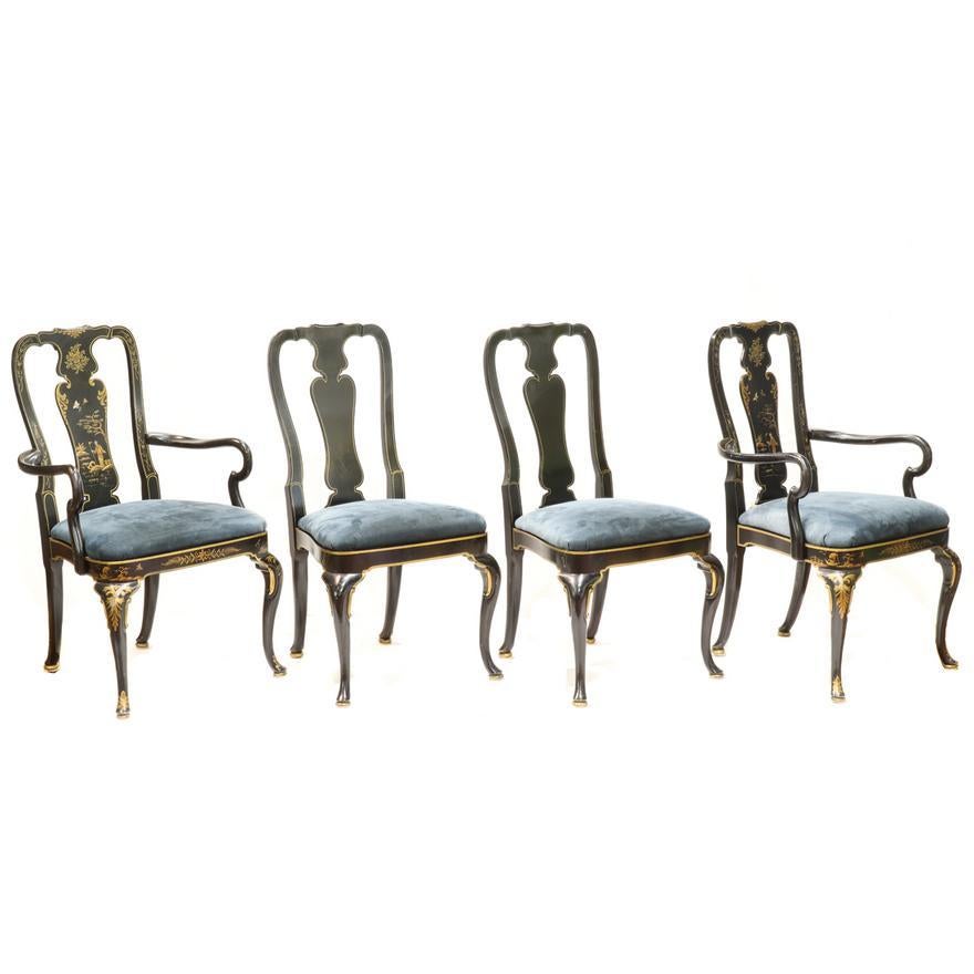 An assembled set of 4 Early 20th C George III style ebonized and Japanned chairs, each having a shield form splat. The armchairs having a scenic partial gilt reserve together with two associated side chairs.