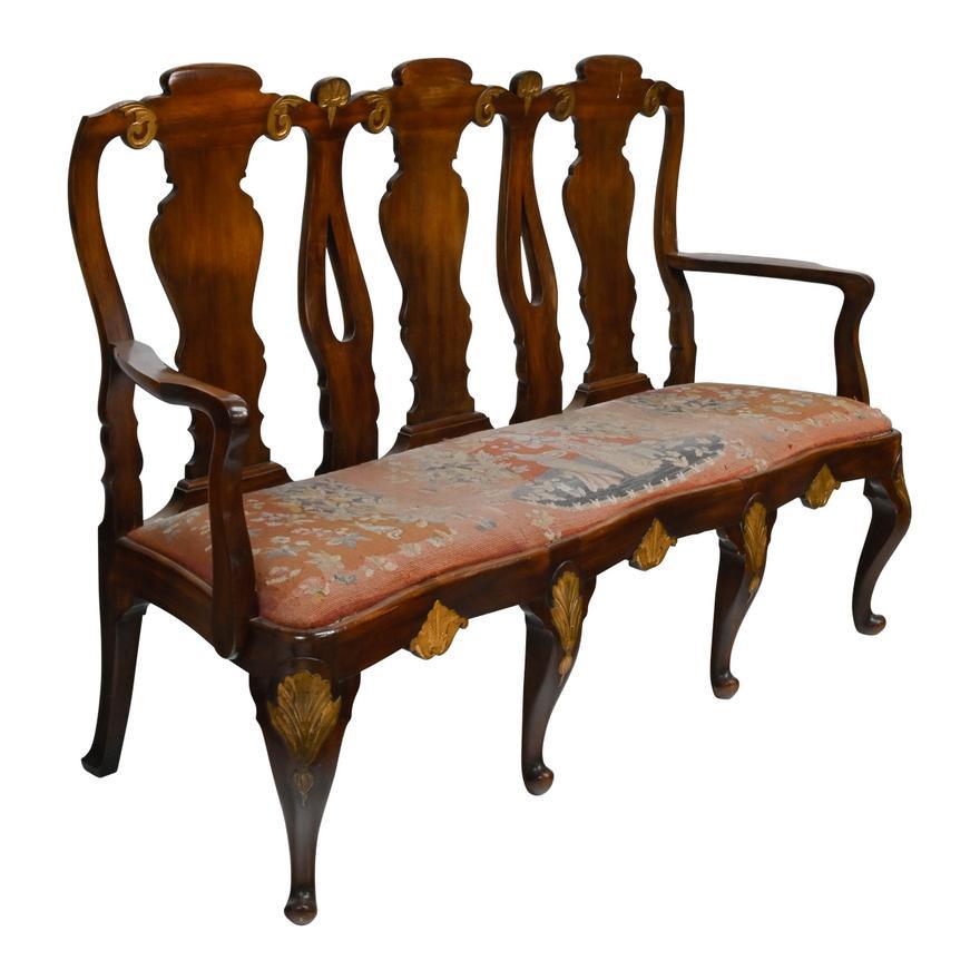 Early 20th Century Georgian Style Mahogany Triple Back Carved Mahogany Settee. Carved Georgian style chair backs, parcel gilt, with needlepoint upholstered seat. Intricate carving throughout.