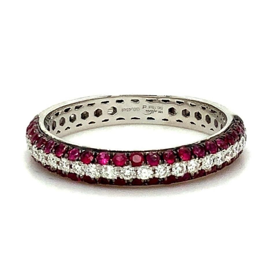 Afarin Collection 3 Rows Pavé Ruby and Diamond band set in 18K White Gold
23 Round Brilliant Cut Diamonds =0.19 ct
32 Round Brilliant Cut Natural Ruby =0.45 ct
The diameter is 3.39 x 3.30 mm
Excellent Make and Polish
Weight is 2.8 grams

Finger Size