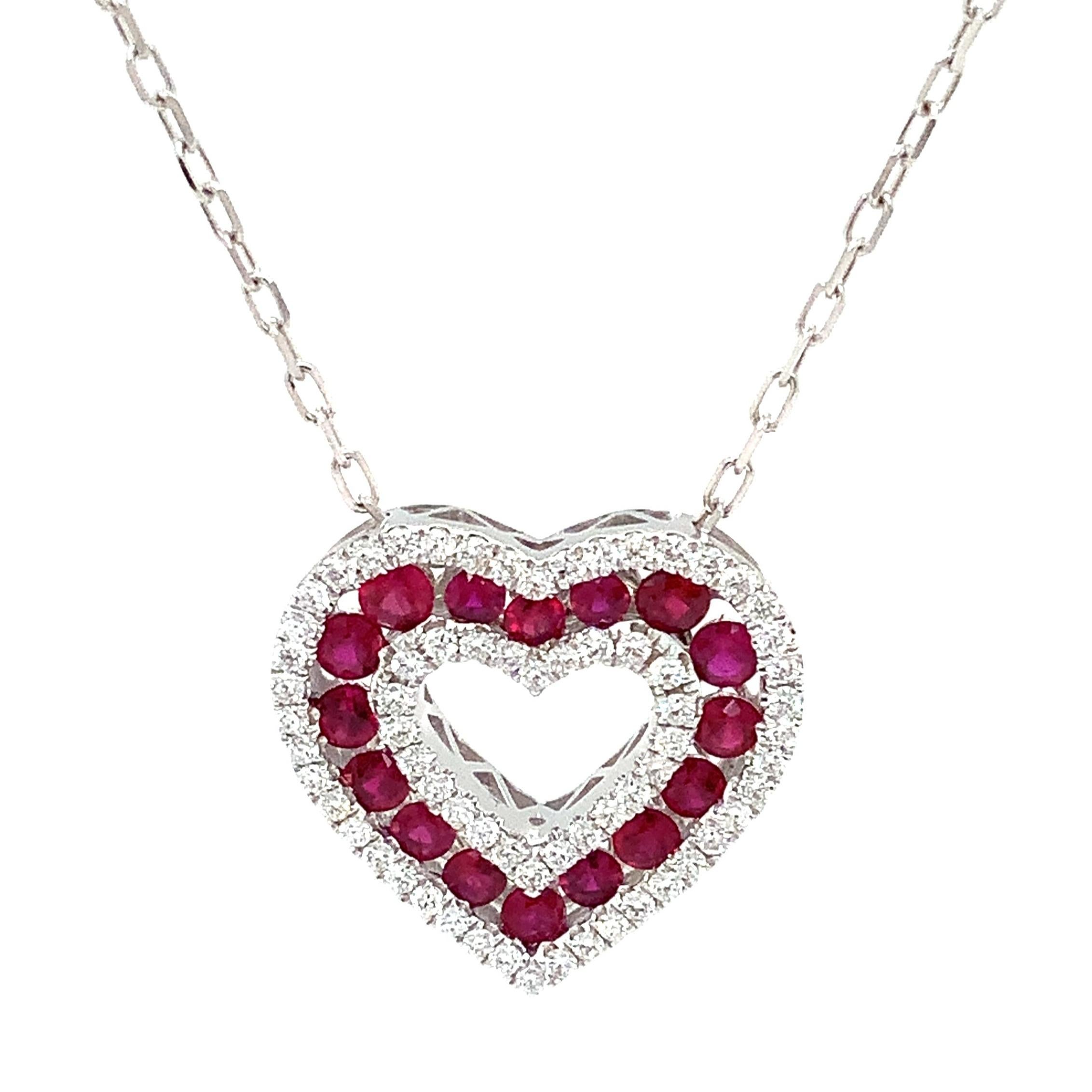 Afarin Collection Classic 3 Row African Ruby and Diamond Heart Shape Necklace Set in 18K White Gold. This is a beautiful and modern twist on the classic heart pendant.
16 Round Rubies =0.80 cts t.w.
 68 Round Brilliant Cut Diamond =0.33 cts t.w.
18