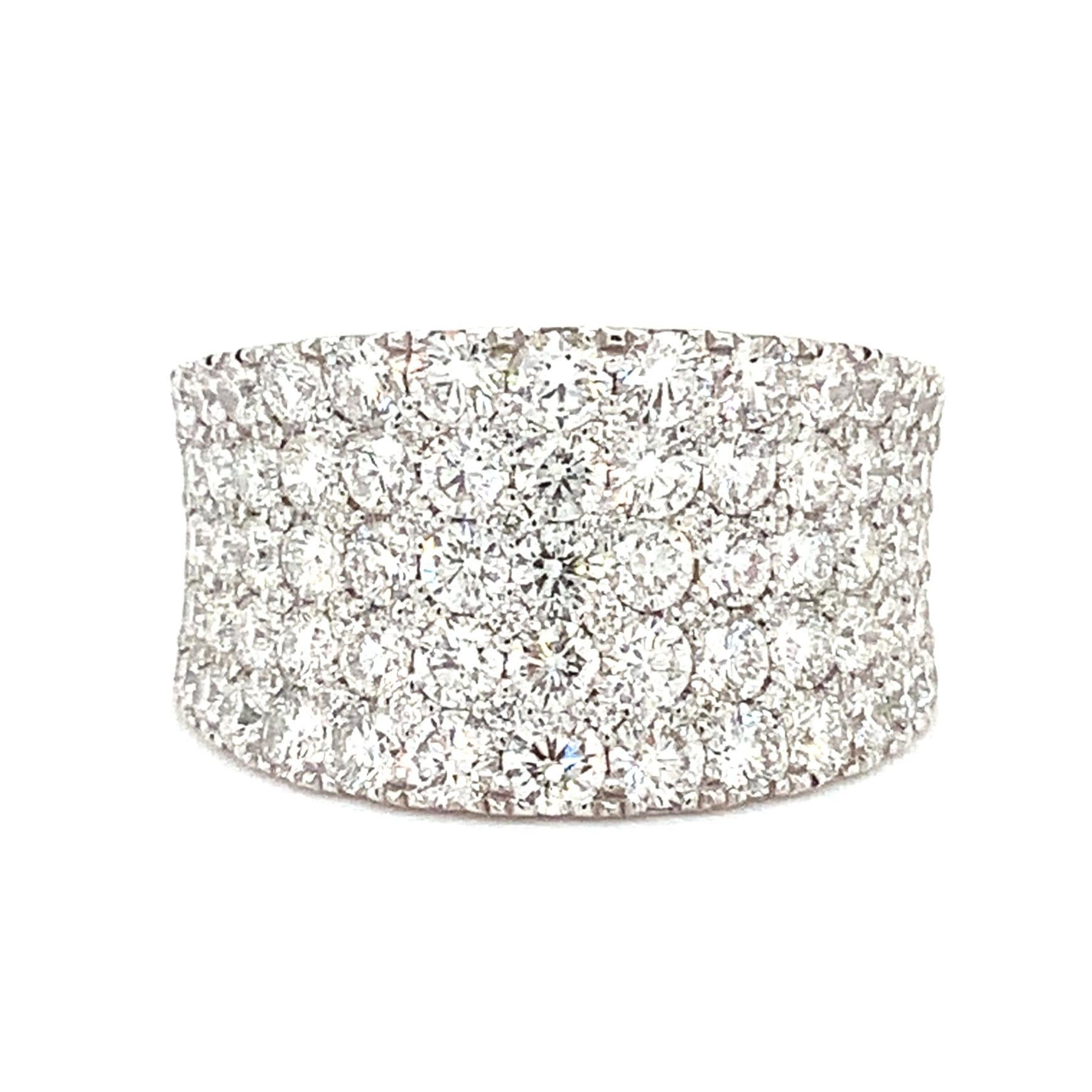 This Spectacular Afarin Collection band consists of five rows of concave pavé diamonds meticulously placed in 18Kt white gold, boasting a combined weight of 2.71 carats. The precision cutting of each stone enhances its clarity and luminosity,
