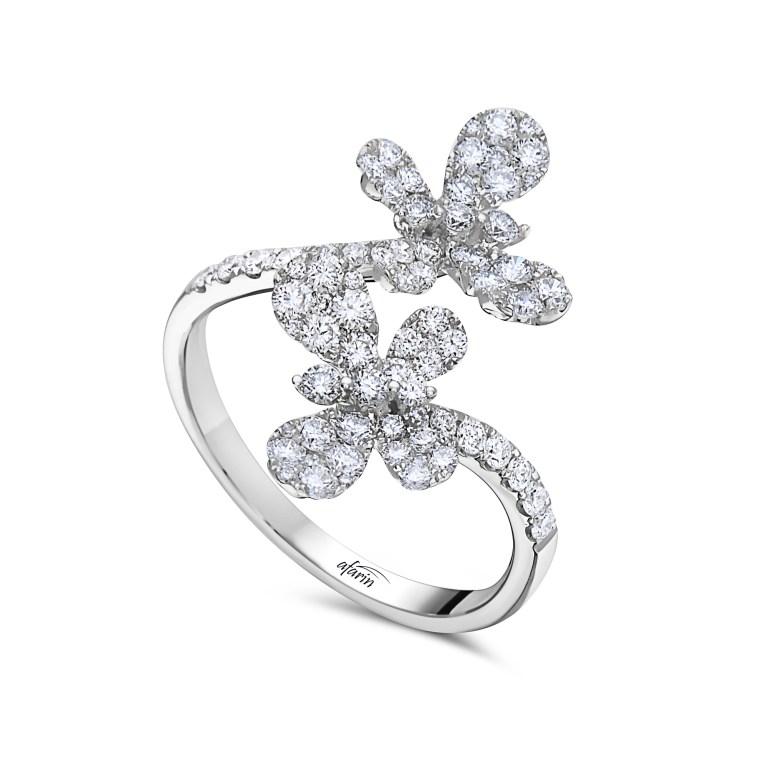 This Afarin Collection Diamond Butterfly Bypass Ring in 18Kt White Gold
This Ring measures 22 mm by 2 mm and has a weight of 3.4 grams. It features 0.92 Ct of Brilliant Cut Diamonds with an F Color and VS Clarity and is finished with an Excellent