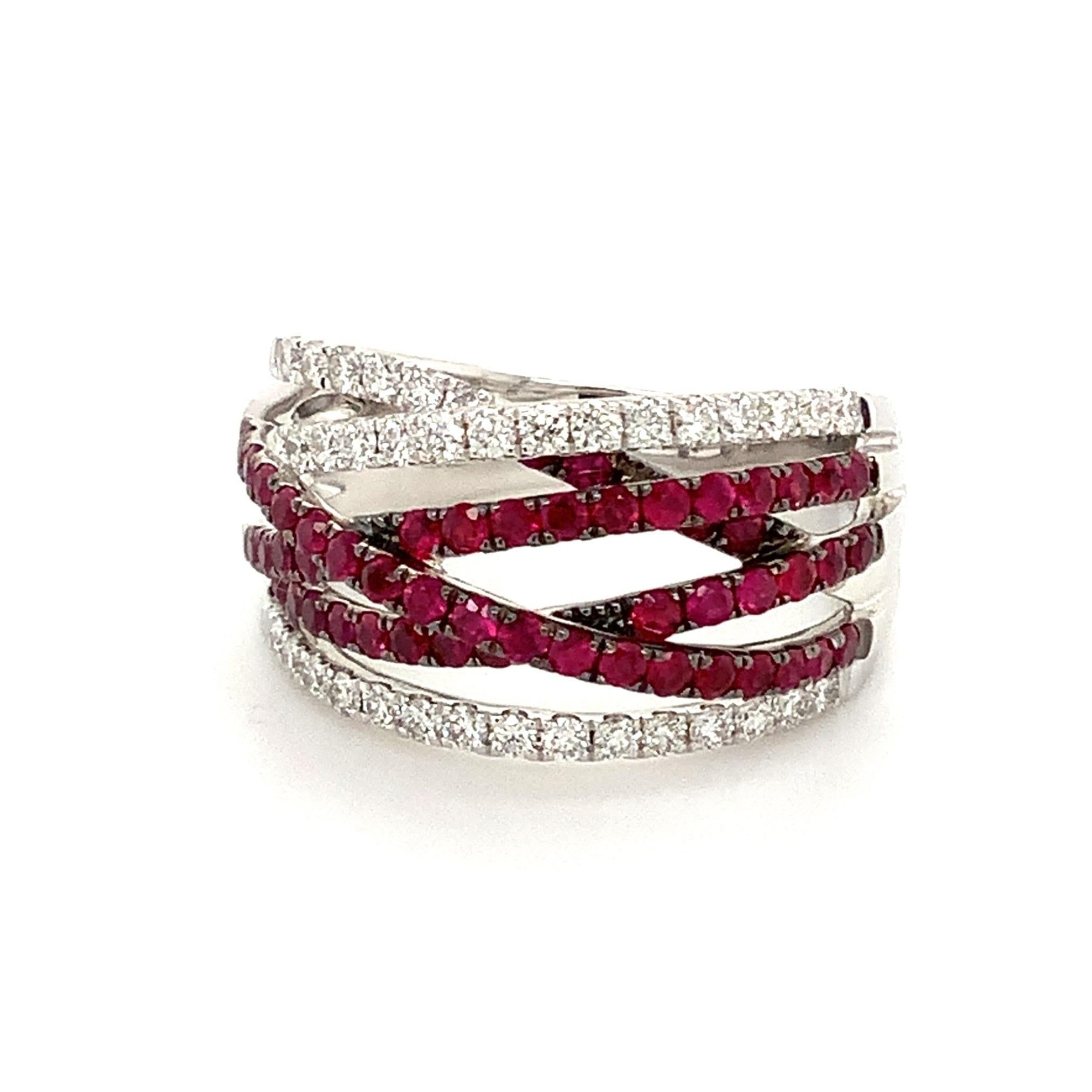  This Afrin Collection Over and Under Six Row Woven Band in 18 Kt White Gold Features Black Rhodium Detailing.
Round Brilliant Cut Diamonds = 0.47 cts t.w.  G in Color VS in Clarity
Brilliant Cut Rubies = 0.85 cts t.w. Bright Red Medium Dark Red