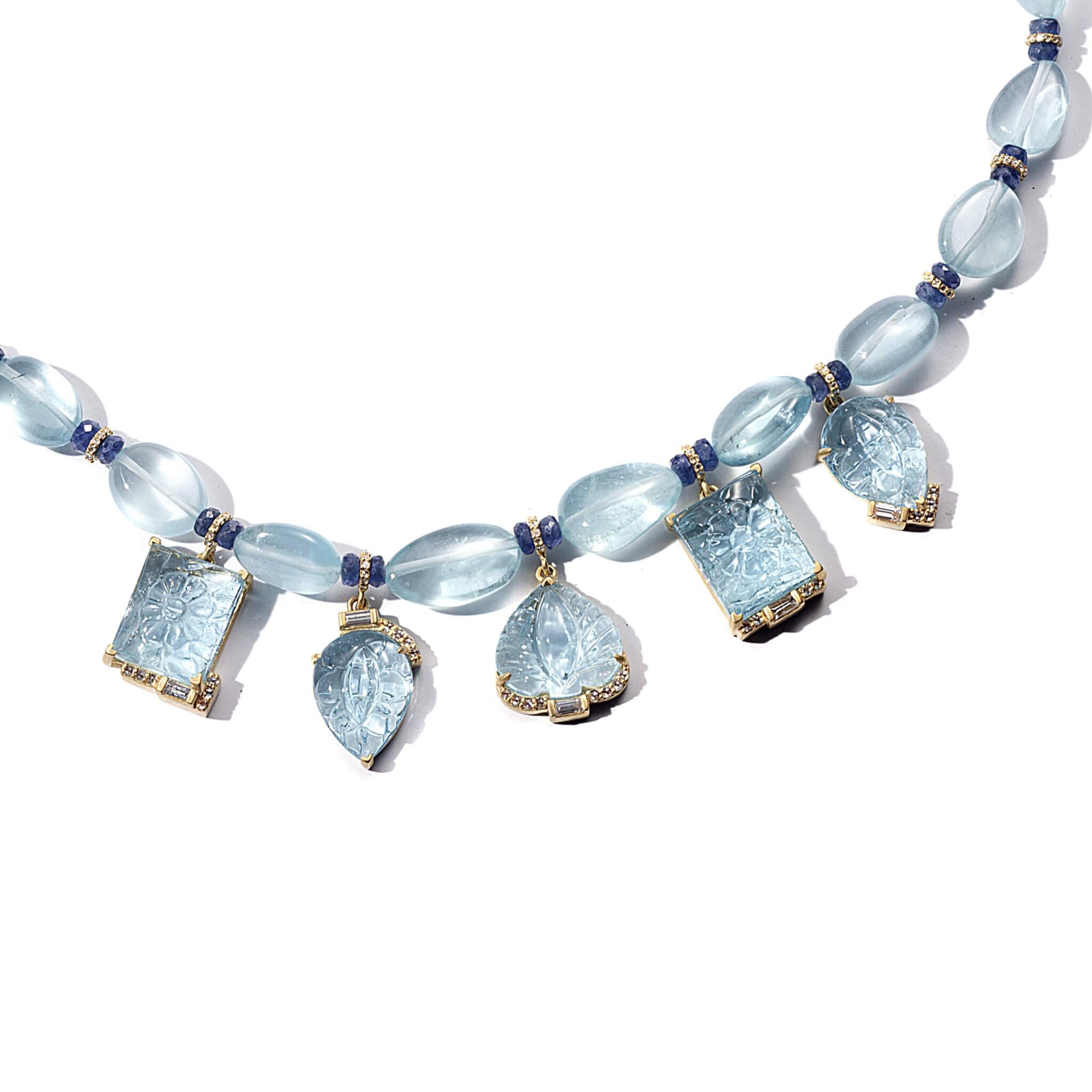 Affinity 16 Inch + Extender Necklace with 109.51CTS of Carved and Beaded Aquamarine, 10.05CTS of Blue Sapphire Beads, and 1.68CTS of Diamonds. Set in 20K Gold.