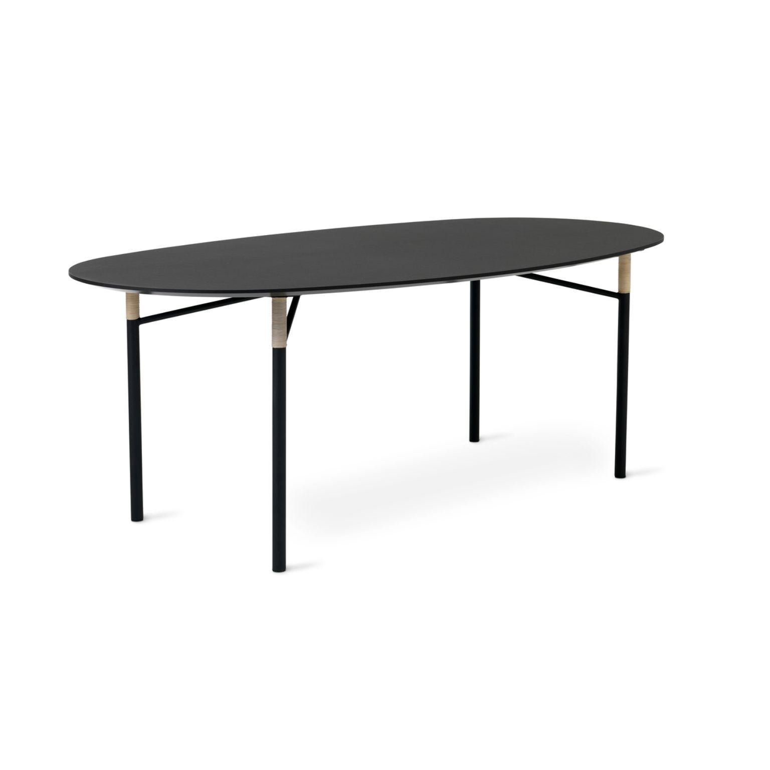 Affinity Ellipse dining table black by Warm Nordic
Dimensions: D200 x W108 x H75 cm
Material: Linoleum, MDF tabletop, Powder coated steel legs, Cane wrappings
Weight: 26 kg

Warm Nordic is an ambitious design brand anchored in Nordic design