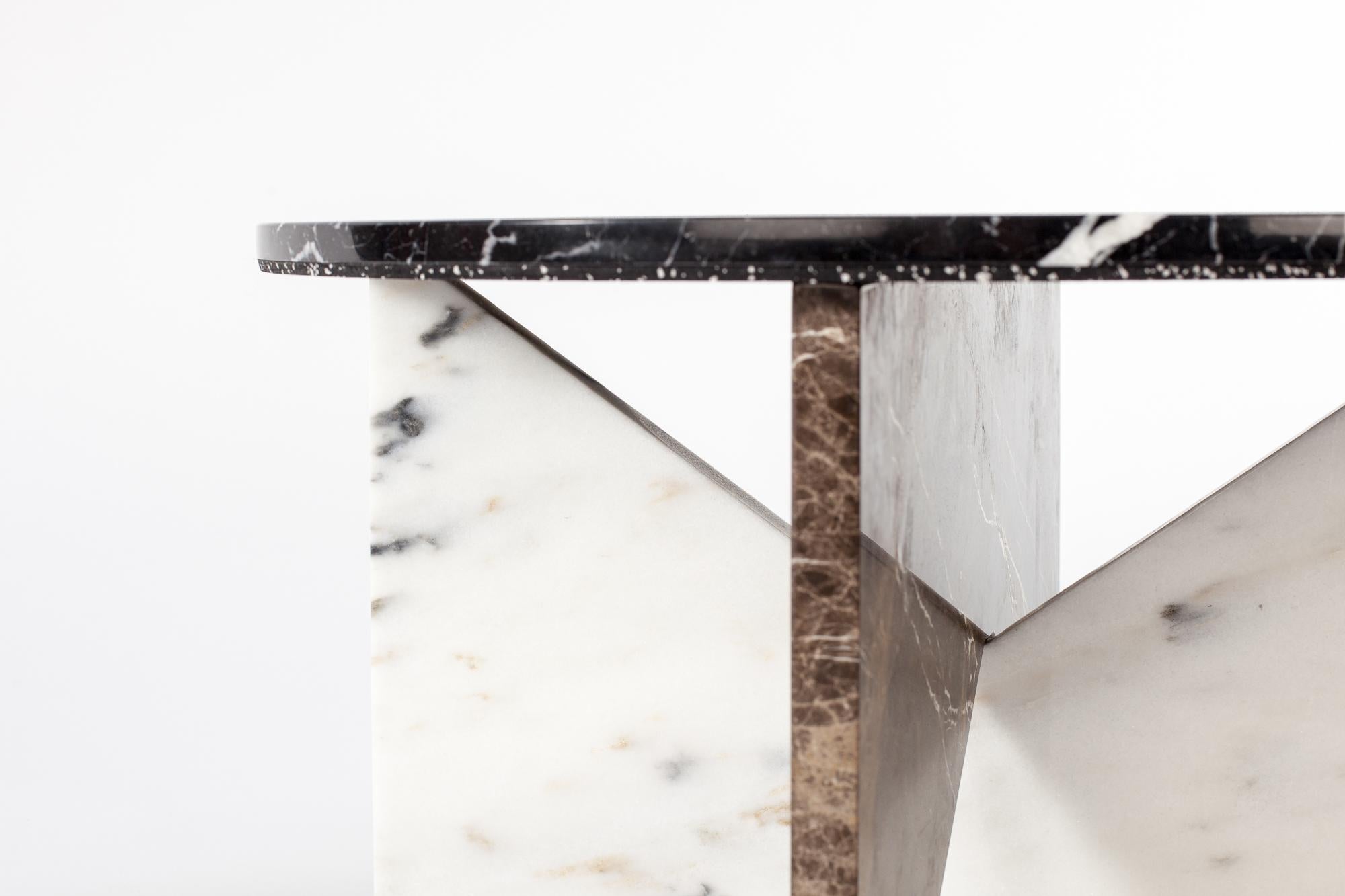 Affordances brings the simple elegance of essential forms together with time honored materials. Designed to be flat packed, inter-locking legs made of either wood or marble create a foundation to support a marble top.
       