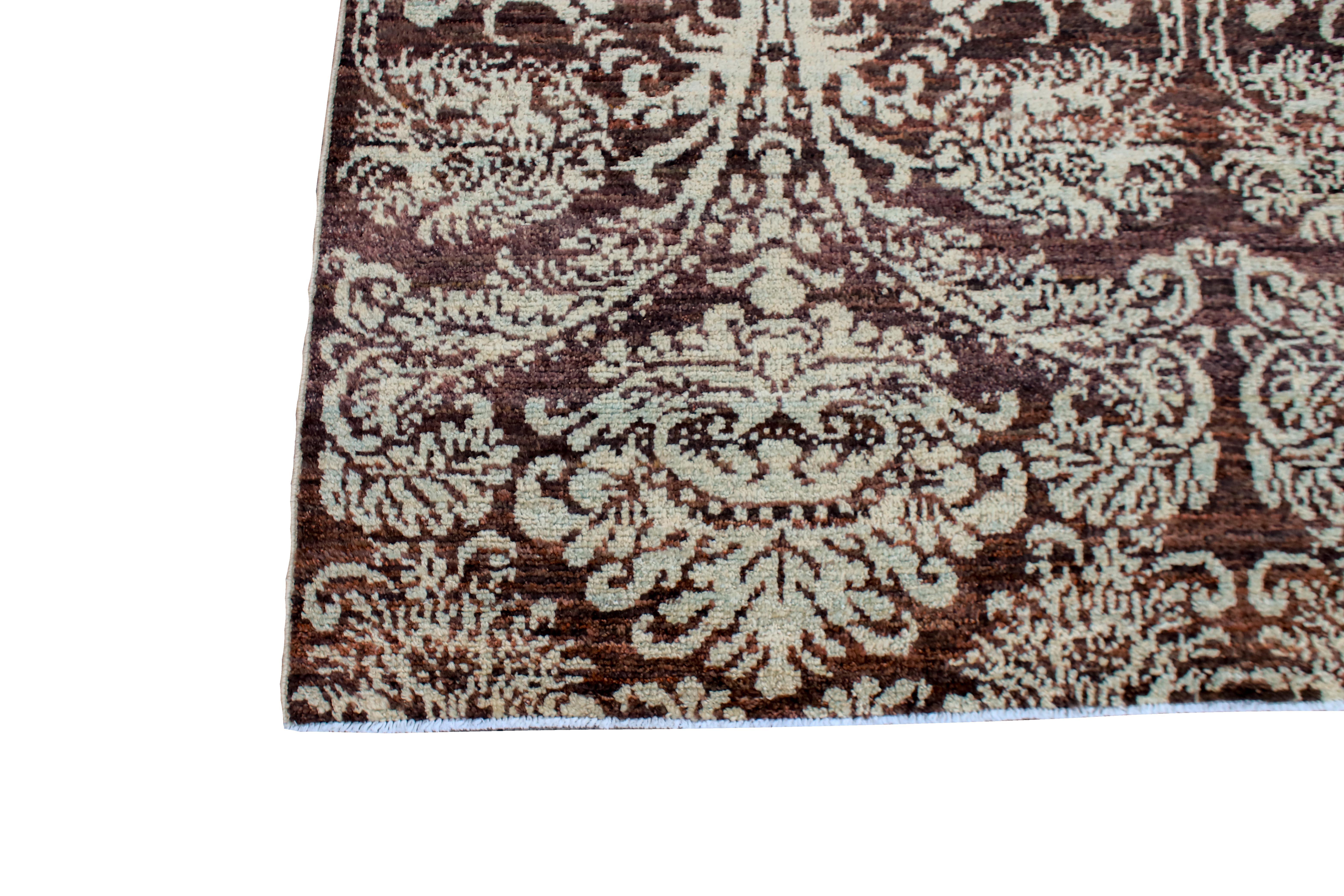 Afghan brown floral motif designed 10 x 14 rug.
Hand knotted with hand-spun wool, woven in Afghanistan.
This beautifully designed rug will be sure to stand out in any room. Measures: 10’7’ x 13’1