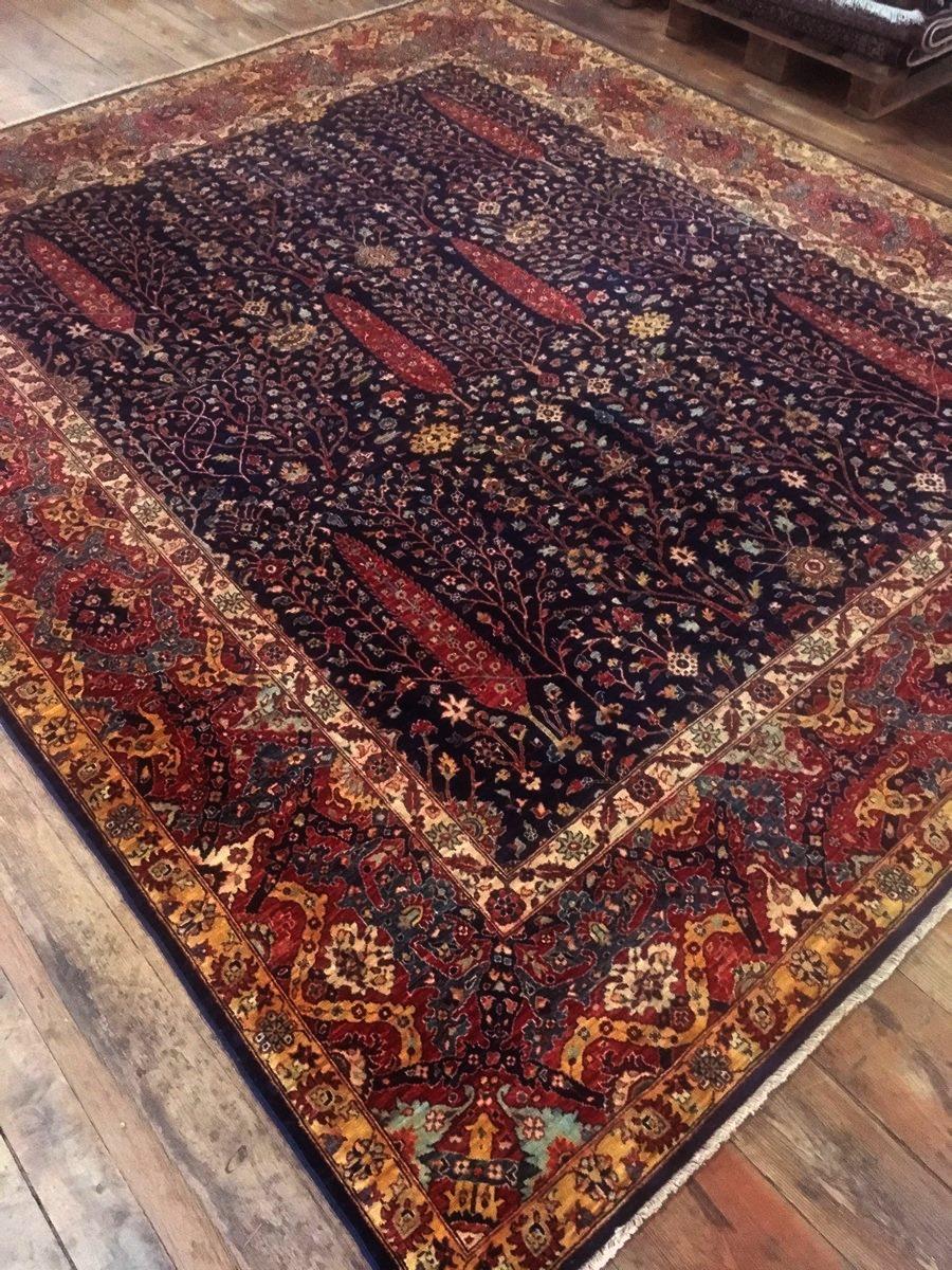 This new Afghan carpet was hand-knotted using finest hand spun and vegetable dyed wool. The design shows an antique Bakhshaish rug motive with a banded border and trees of life in the centre. It has a very dense knotting and a silk like luster.