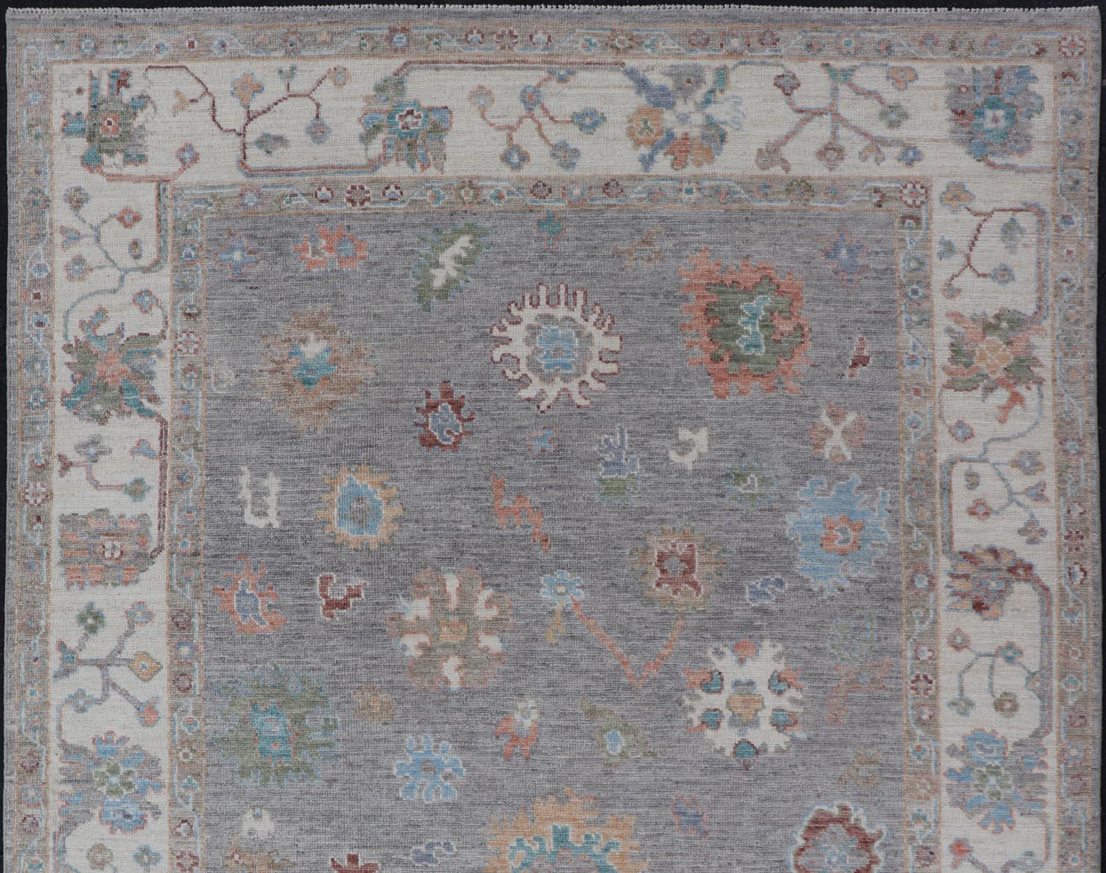 Hand-Knotted Hand Knotted Floral Oushak With a Gray Background And Multi-Colors For Sale