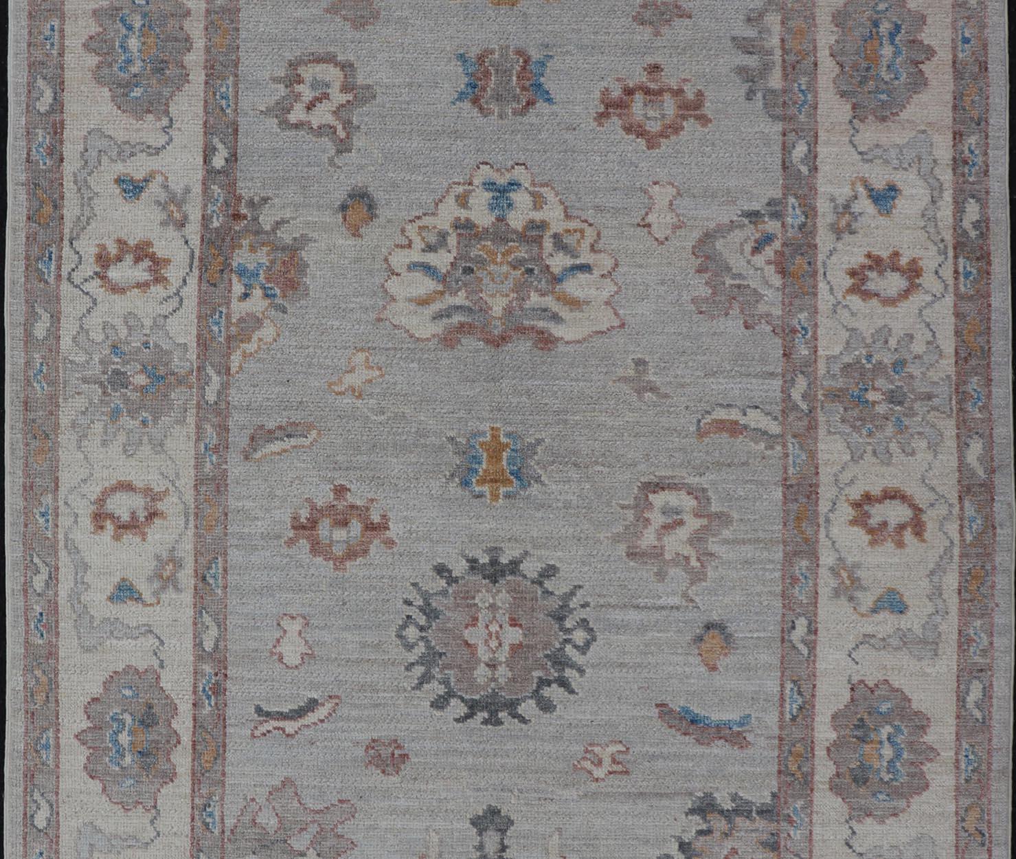Contemporary Floral Oushak with Muted Gray Background and Cream Border For Sale