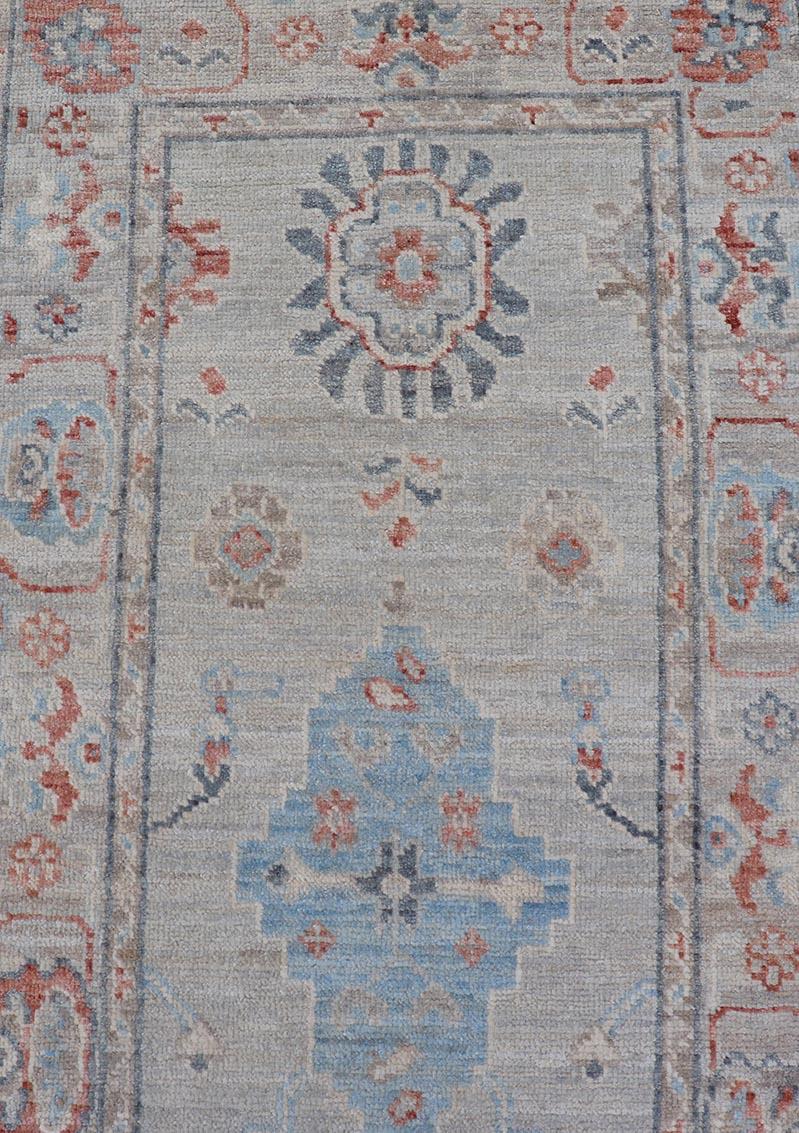 Afghan hand-knotted Oushak runner fearing bright coral and blue tribal and floral motifs on a cool gray background. 

Measures: 2'5 x 11'7 

Keivan Woven Arts: rug AWR-6361 Country of Origin: Afghanistan Type: Oushak Circa: 2010 Key Words: Persian