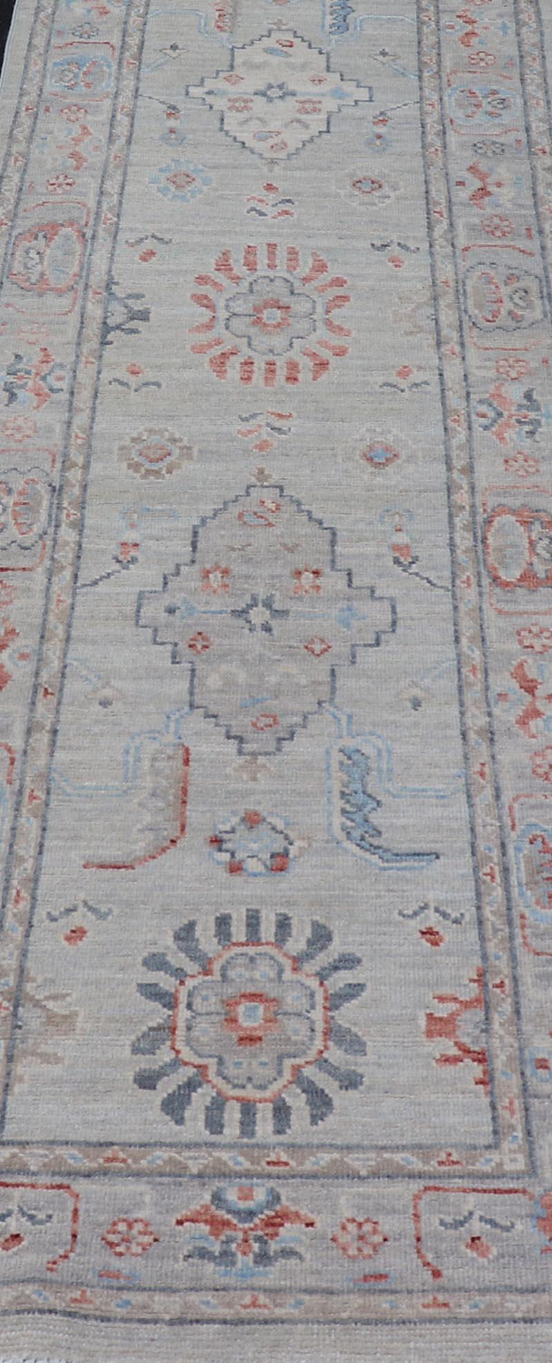 Afghan Hand Knotted Oushak with Coral and Blue Motifs on Light Gray Background In New Condition For Sale In Atlanta, GA
