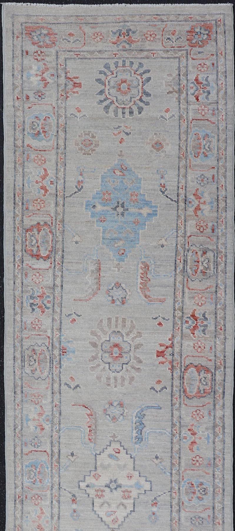 Afghan Hand Knotted Oushak with Coral and Blue Motifs on Light Gray Background For Sale 1