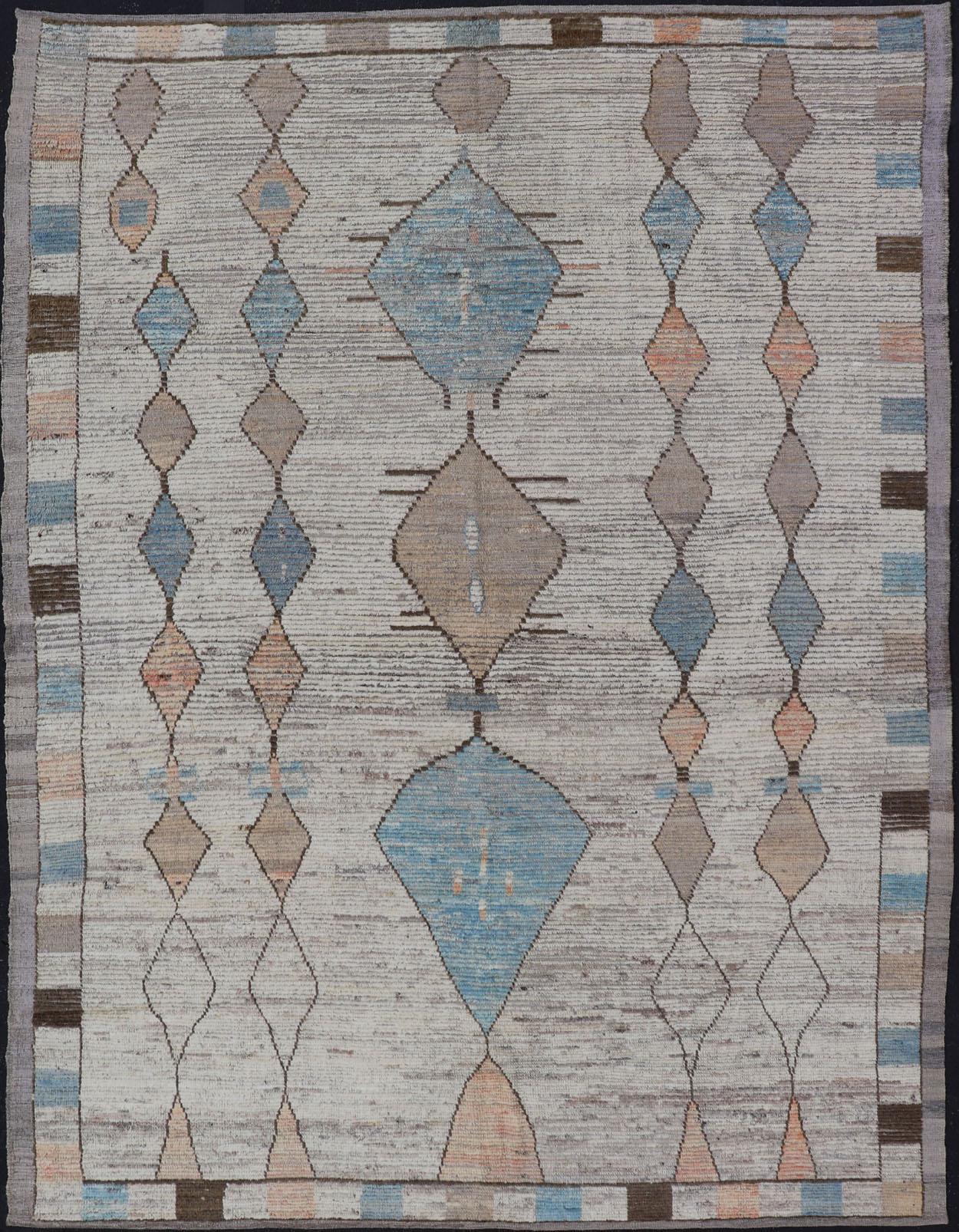 This modern casual area rug features a tribal diamond design reaching down the length of the field, alternating between turquois and a fleshy peach. The earthy tones give the rug an over-all aged look, while keeping it's casual charm. The background