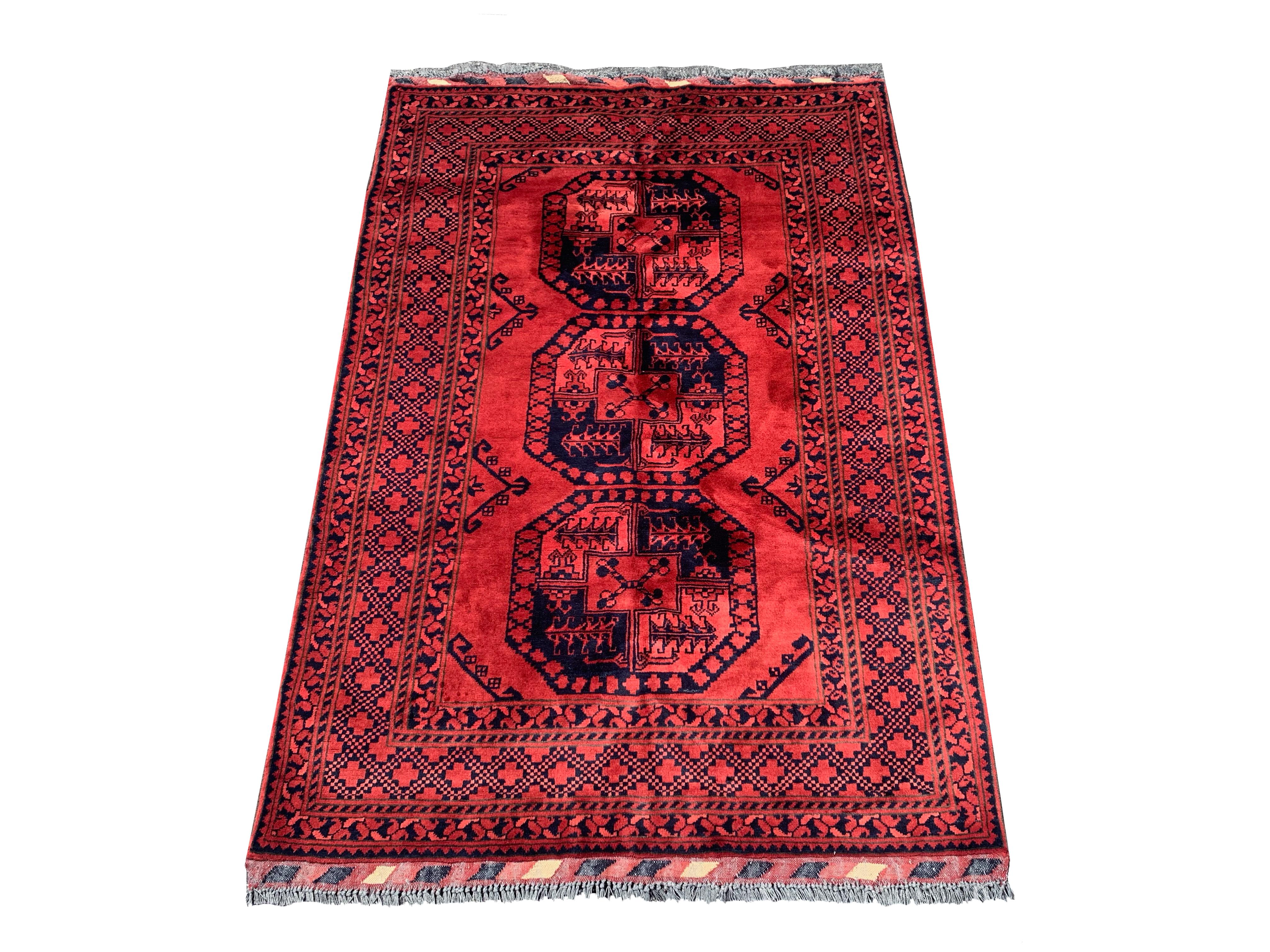 Hand-knotted wool pile on a cotton foundation.

Dimensions: 4' x 6'

New

Origin: Afghanistan

Field Color: Red

Border Color: Red

Accent Color: Navy-Blue