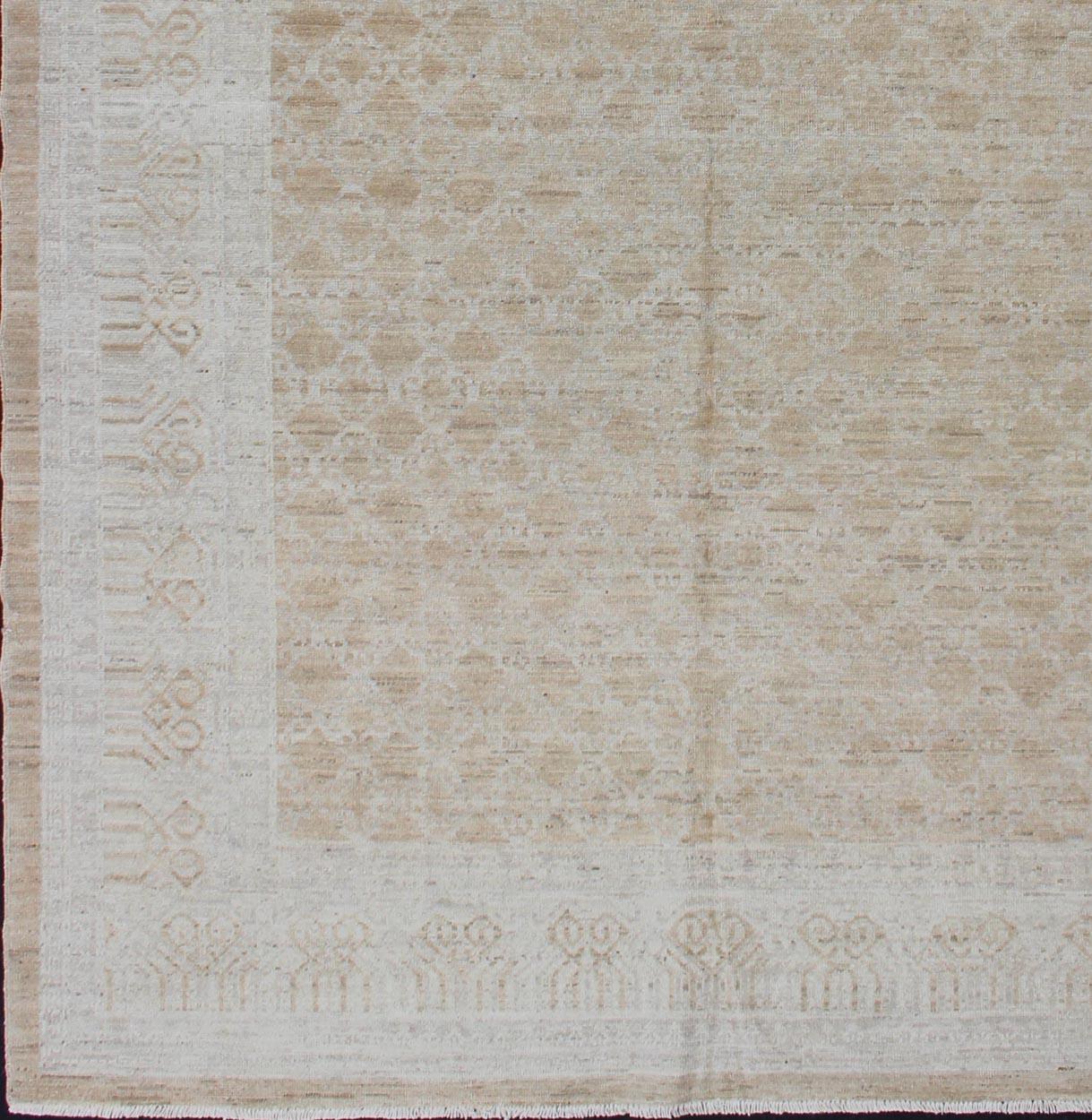 Khotan rug with geometric Medallions, rug 1912-269, country of origin / type: Afghanistan / Khotan

This Khotan features a geometric all-over design flanked by a repeating pattern in the border. The entirety of the piece is rendered in light tones,