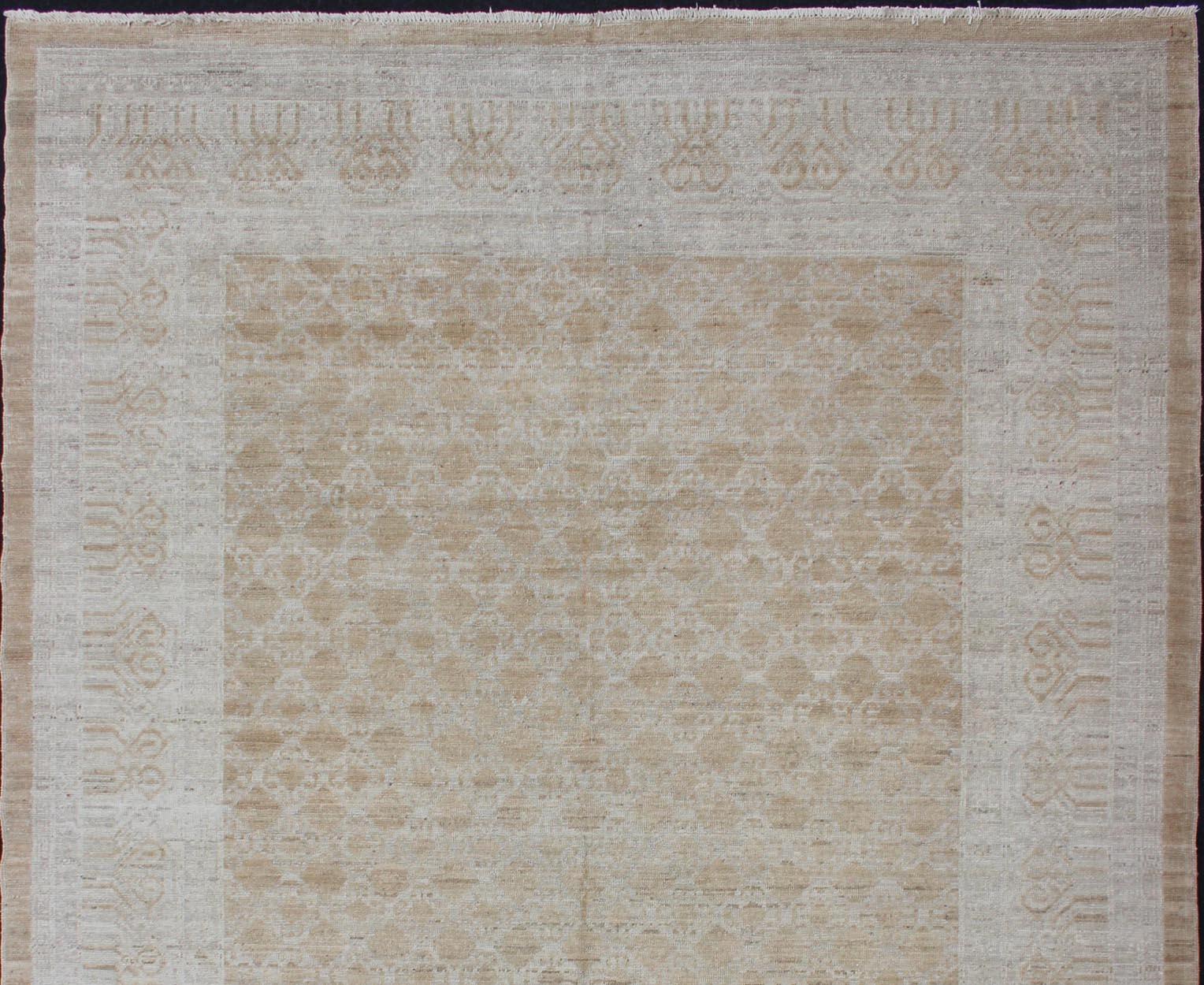Afghan Khotan Rug in Soft Gold and All-Over Pattern with Geometric Border In New Condition For Sale In Atlanta, GA