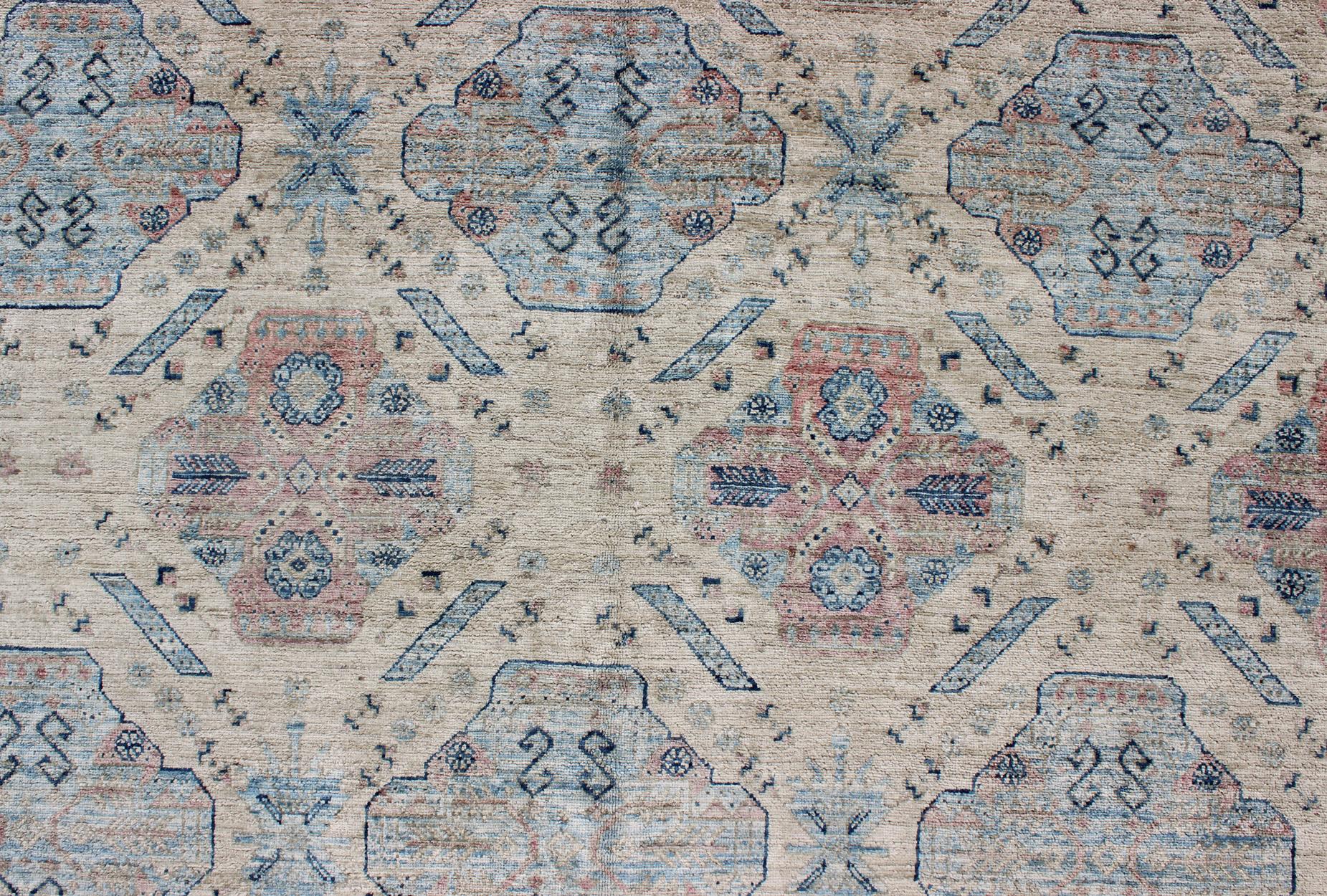 Light Khotan rug with geometric Medallions, rug KOL-67784 country of origin / type: Afghanistan / Khotan

This Khotan features a geometric all-over design flanked by a repeating pattern in the border. The entirety of the piece is rendered in light