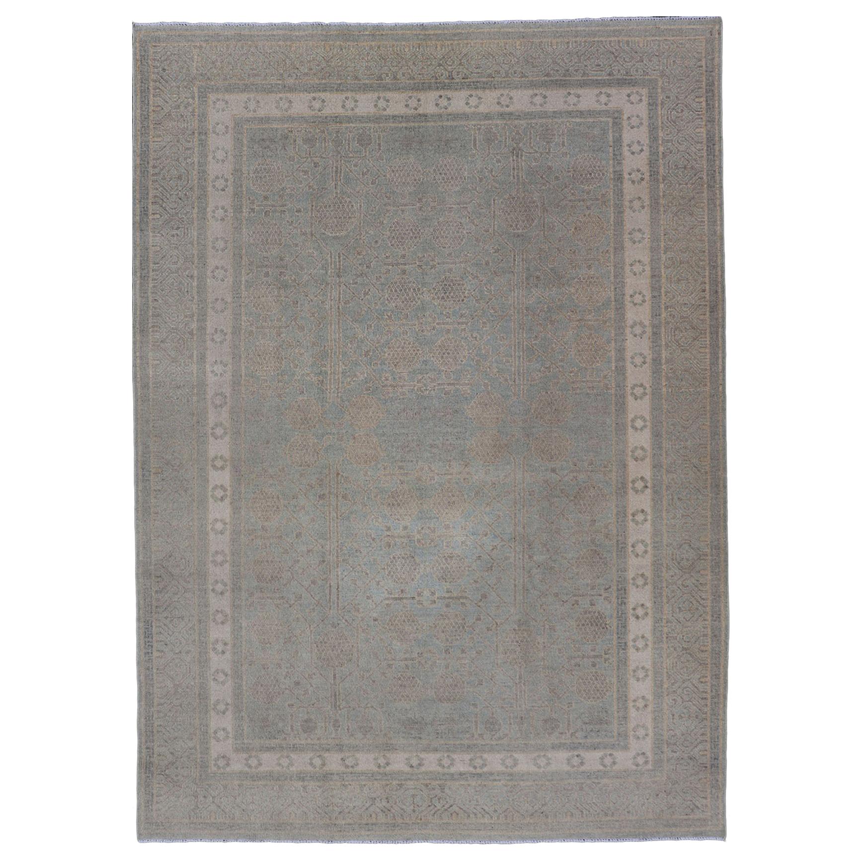 Tappeto afghano Khotan con disegno geometrico nei toni dell'azzurro e del grigio.