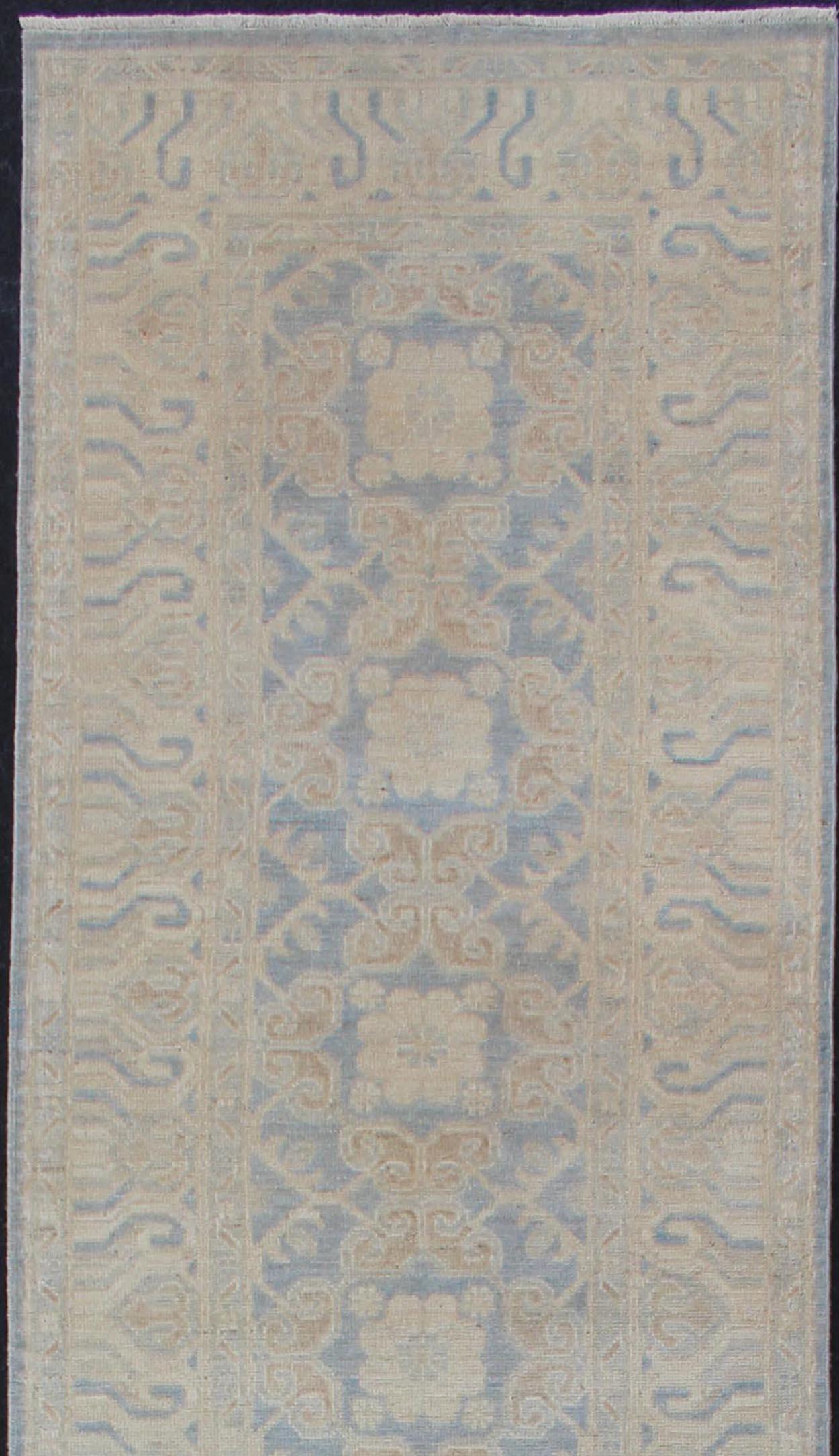 Afghan Khotan runner with Geometric Design in Shades of Powder Blue and Tan Keivan Woven Arts / rug MP-1911-10727, country of origin / type: Afghanistan / Khotan

This Khotan features a geometric multi-medallion design flanked by a repeating