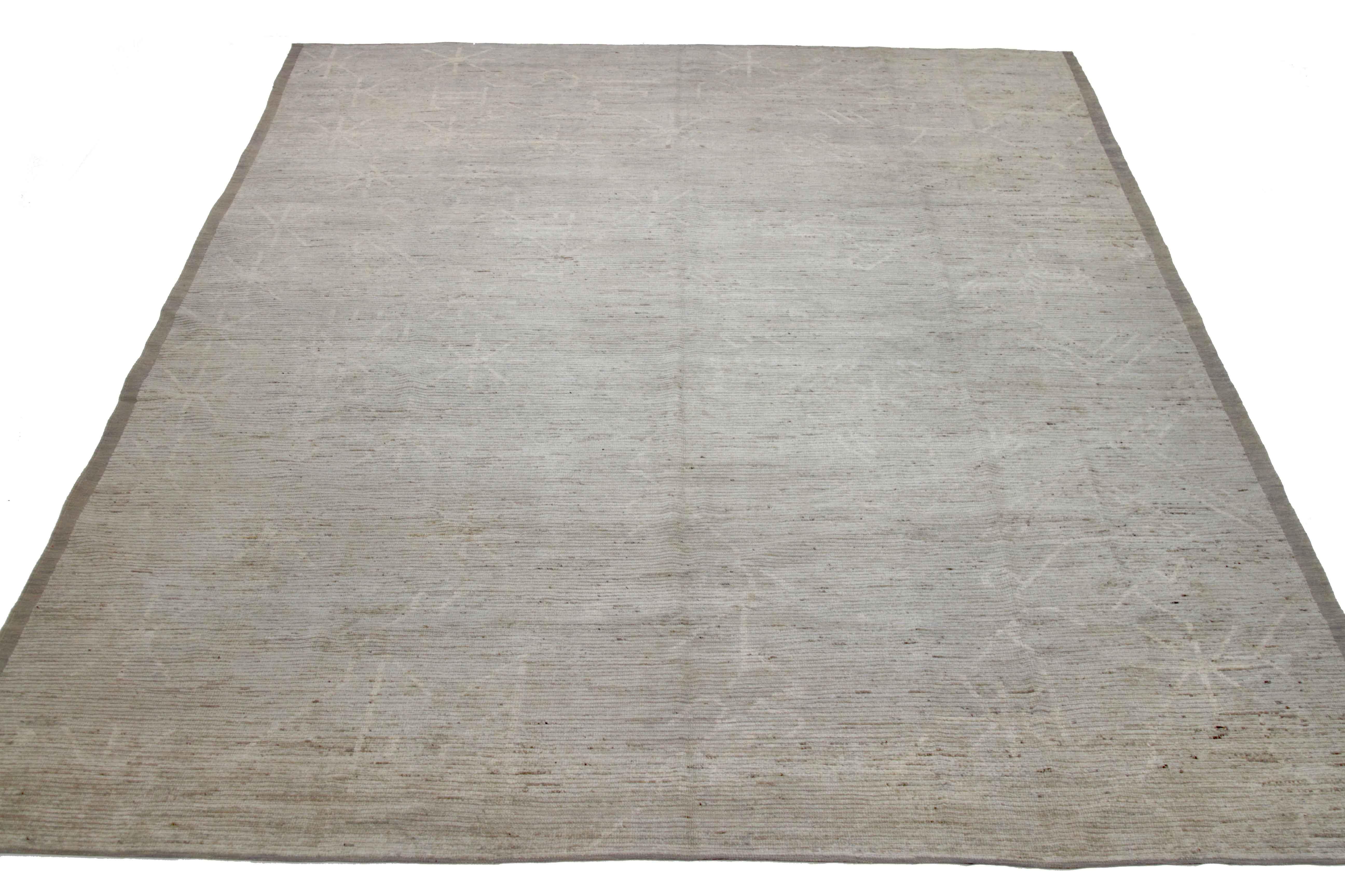 Modern Afghan rug handwoven from the finest sheep’s wool. It’s colored with all-natural vegetable dyes that are safe for humans and pets. This piece is a traditional Afghan weaving featuring a Moroccan inspired design. It’s highlighted by ivory