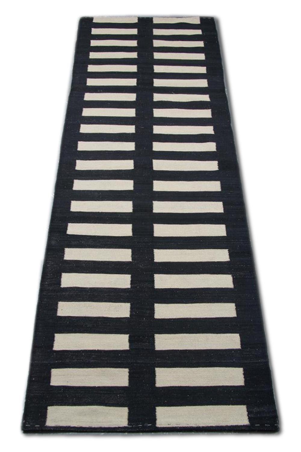 This striped carpet runner is a kind of Kilims indicating a particular flat-weave runner rug. It has been handmade stair runner in Afghanistan with the best wool and cotton by skilful weavers. Also, the high materials are of the highest quality wool
