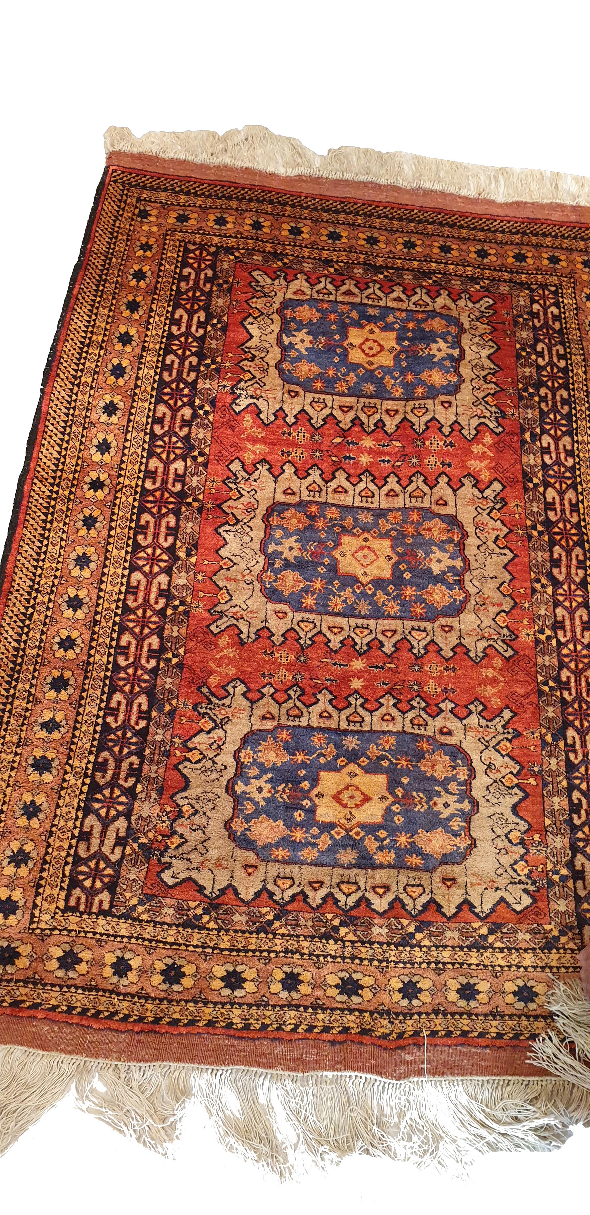 Hand knotted carpet in the mountains of Afghanistan in the mid-20th century.

Geometric representation of red and brown wood.
High quality, beautiful graphics and remarkable finesse.
Density: About 12/13000 knots per dm².
Perfect state of