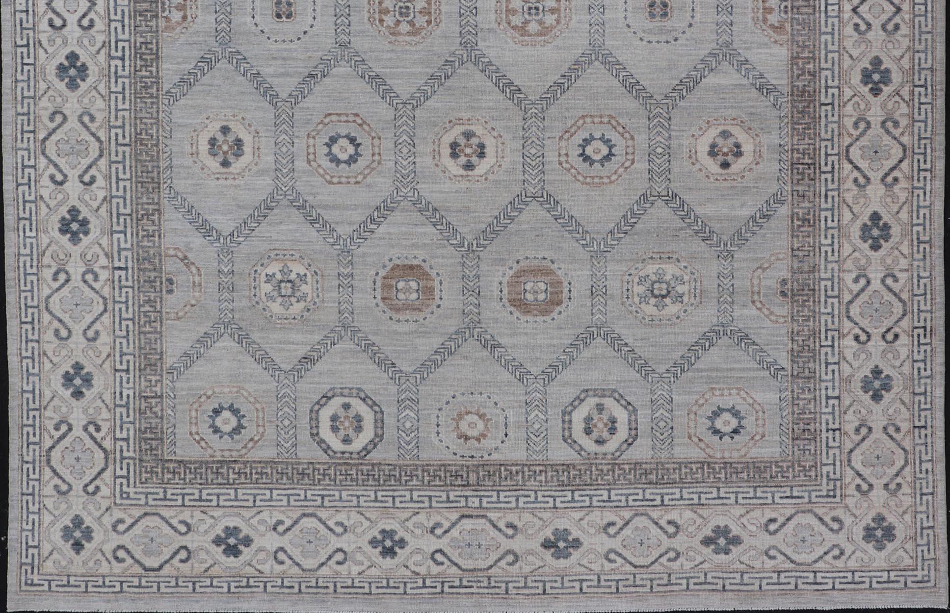 Hand-Knotted Afghan Sub-Geometric Mosaic Khotan Rug with Muted Tones of Blue and Brown For Sale