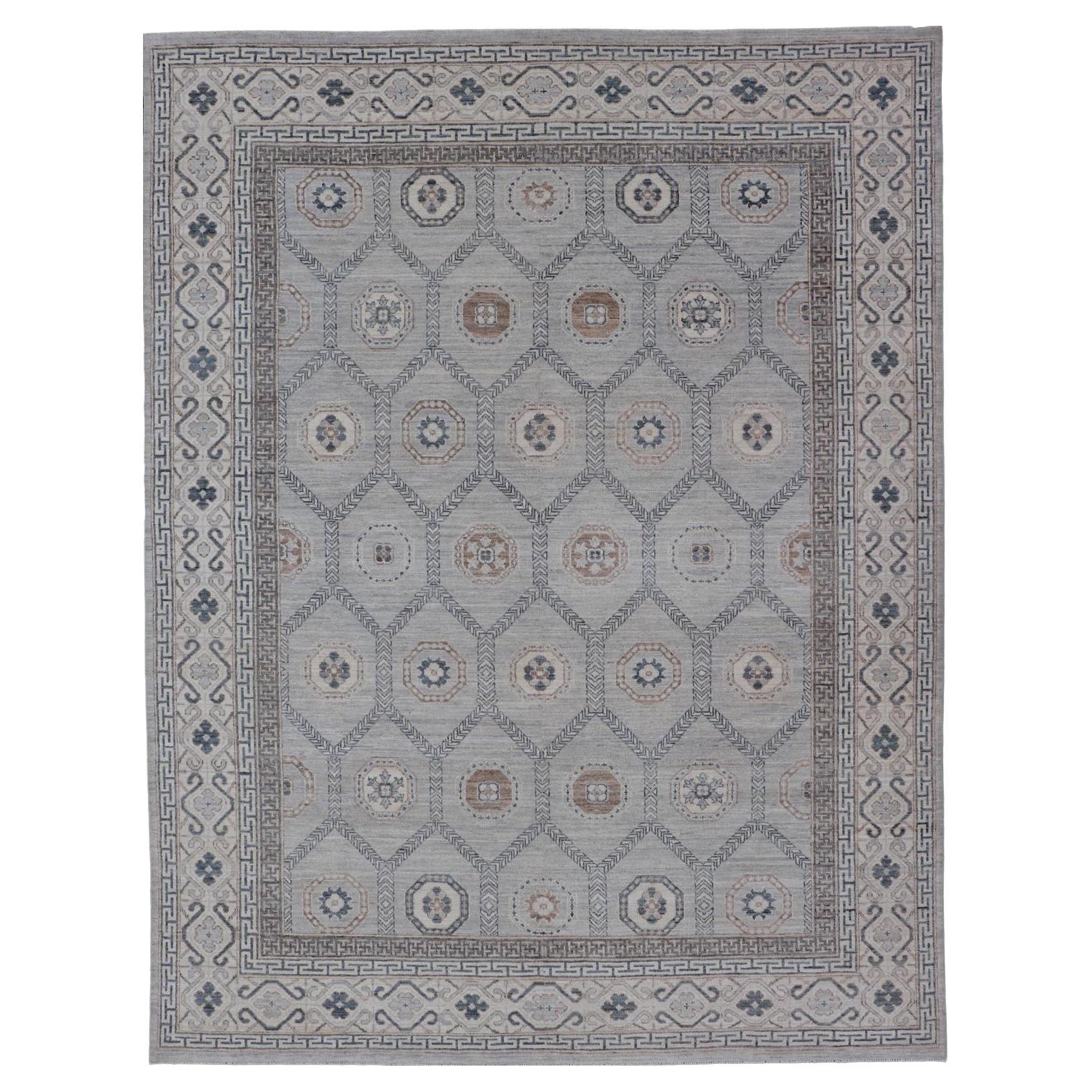Afghan Sub-Geometric Mosaic Khotan Rug with Muted Tones of Blue and Brown