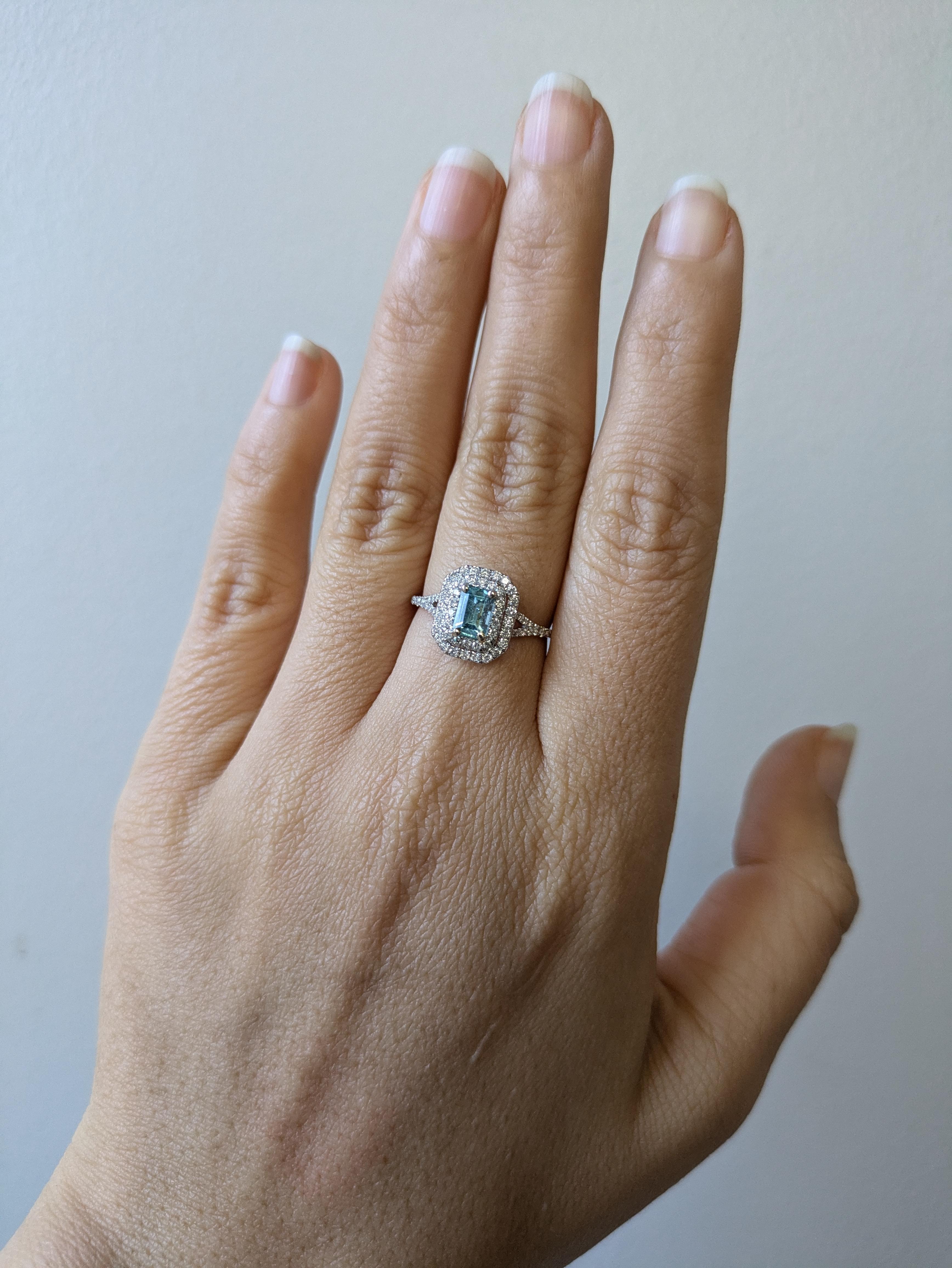 This gorgeous estate ring features a blue Afghan tourmaline showcased in 14k gold ring setting with natural double diamond halo that give an extra sparkle! With radiant diamonds surrounding a tourmaline, this piece is classy and elegant.

**We offer