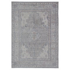 Modern Tribal Oushak with Light Colored Border and Cool Gray Background Modern Tribal Oushak with Light Colored Border and Cool Gray Background