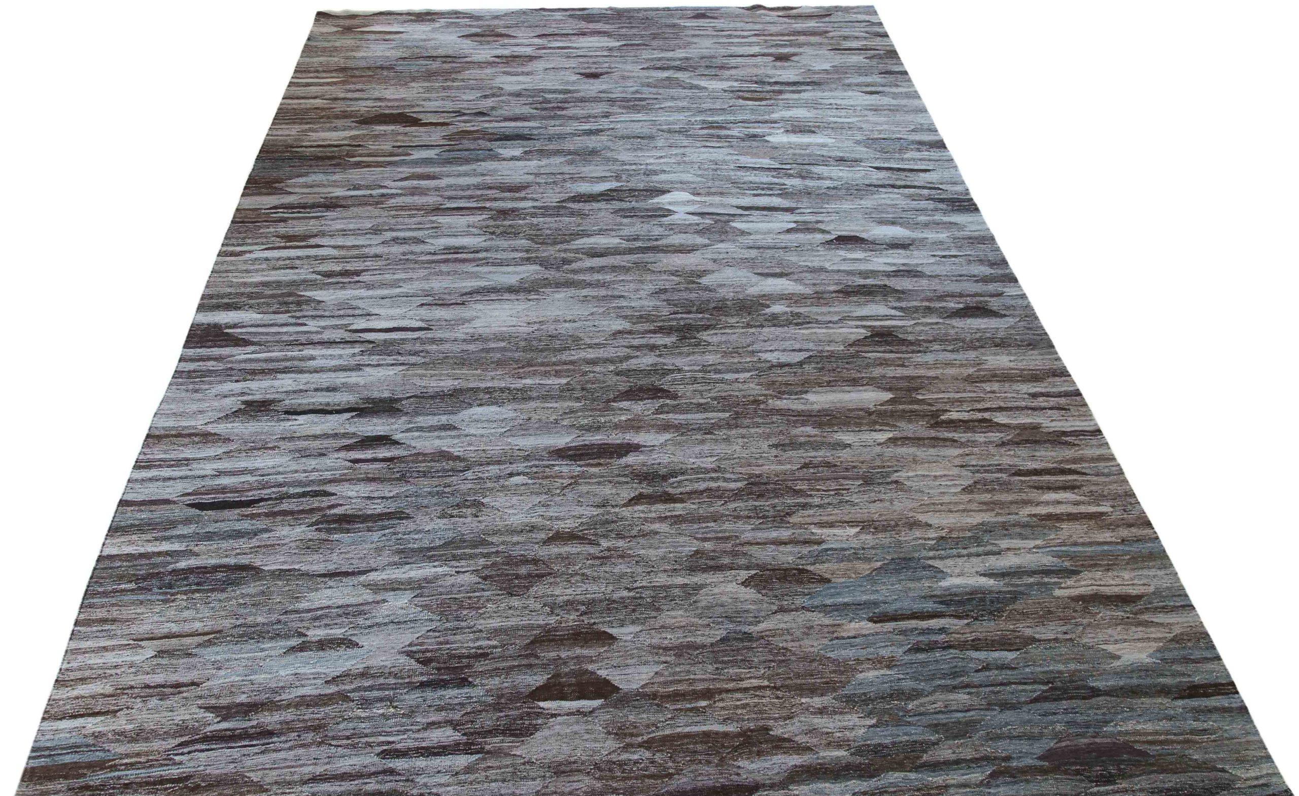 Discover the elegance of Afghanistan Kilim featuring Area Rugs in Circa 1990. Designed with Wool and BlueBrownIvory, this exclusive design is perfect for enhancing your space.