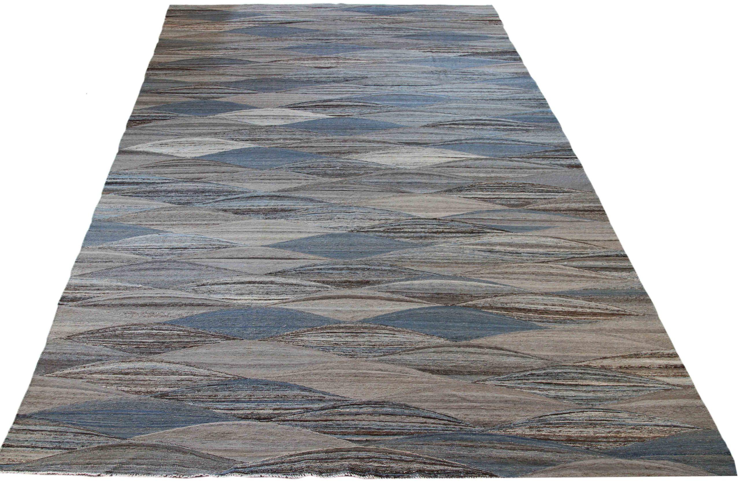 Discover the elegance of Afghanistan Kilim featuring Area Rugs in Circa 1990. Designed with Wool and BlueBrownIvory, this exclusive design is perfect for enhancing your space.