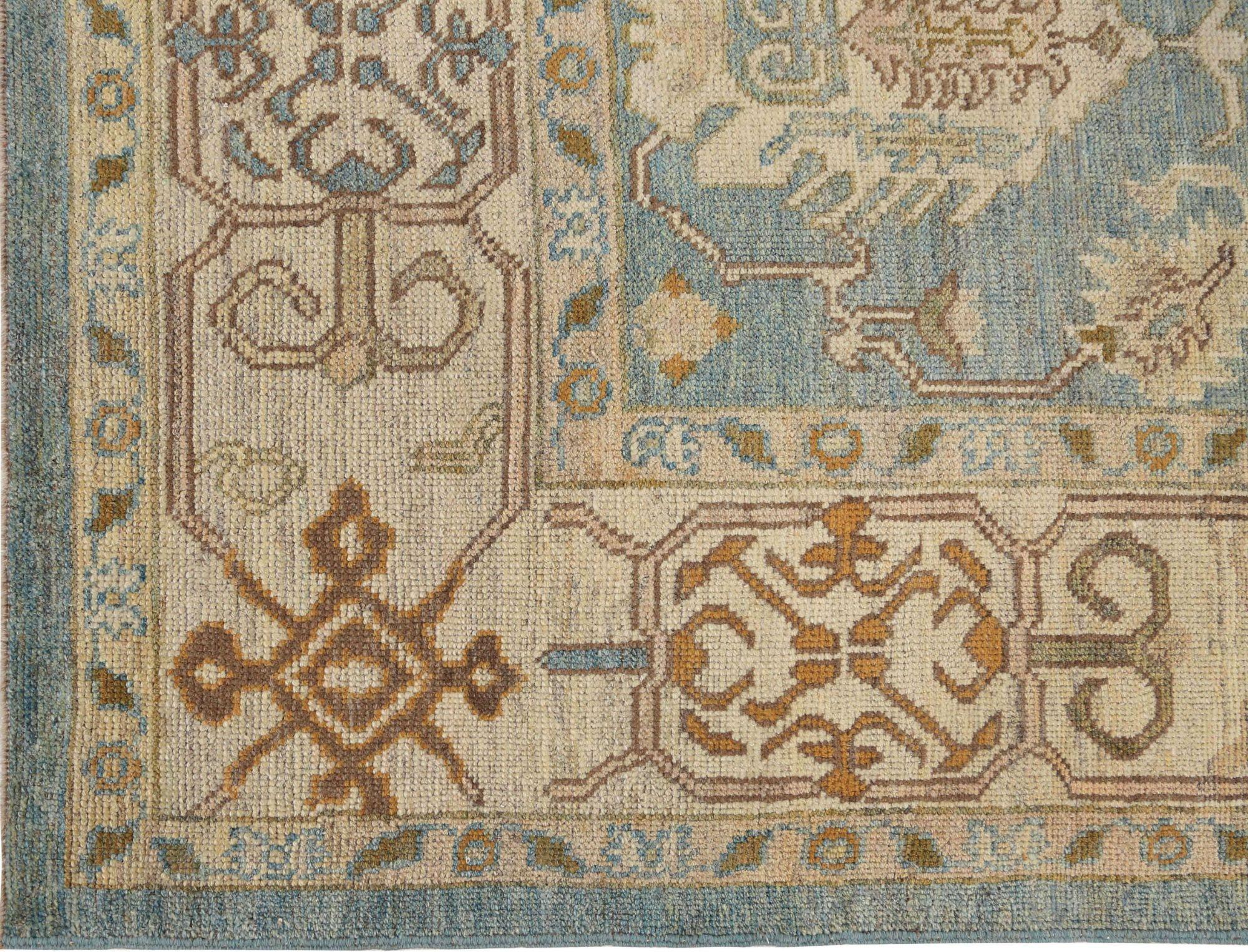 A Serene Oasis: The Captivating Oushak Area Rug in Tranquil Blues
Step into a realm of refined beauty and artistic heritage with this extraordinary Oushak area rug from the heart of Turkey. More than a simple floor covering, this piece is a