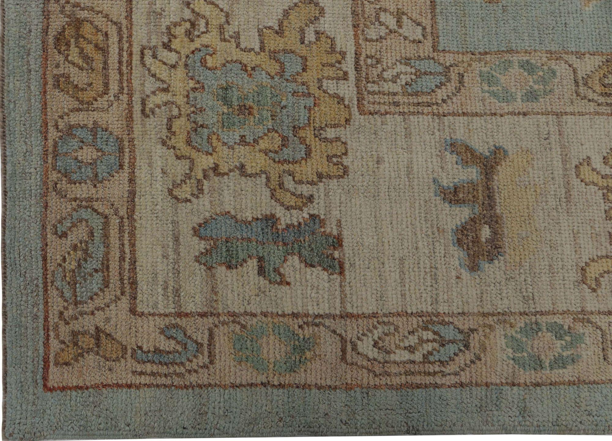 Serene Sophistication: A Modern Turkish Oushak Style Wool Rug
This exquisite area rug is a stunning example of the timeless sophistication of the Turkish Oushak design, masterfully reinterpreted for today's elegant home. It balances a grand,