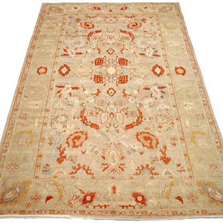 Entdecken Sie die Eleganz von Afghanistan Oushak mit Teppichen von Circa 1990. Dieses exklusive Design aus Wolle und Blau-Elfenbein-Rot ist perfekt, um Ihren Raum zu verschönern.