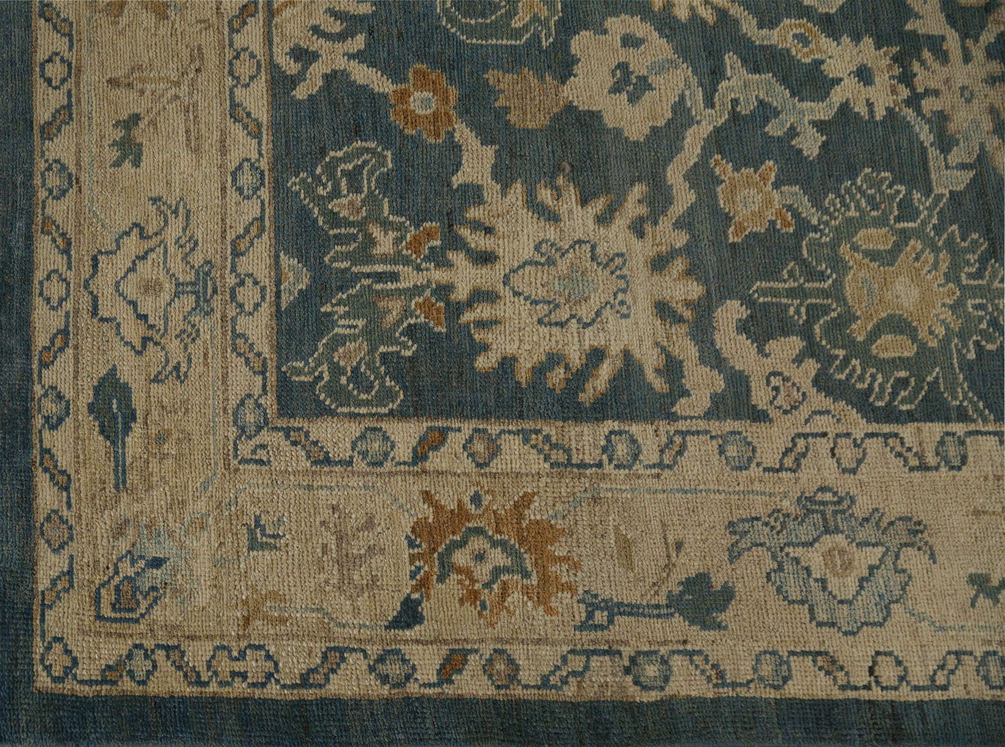 A Midnight Bloom: The Dramatic Elegance of a Modern Turkish Oushak Rug
This magnificent area rug is a captivating reinterpretation of the classic Turkish Oushak design, created for a bold and sophisticated modern interior. It is a masterpiece of