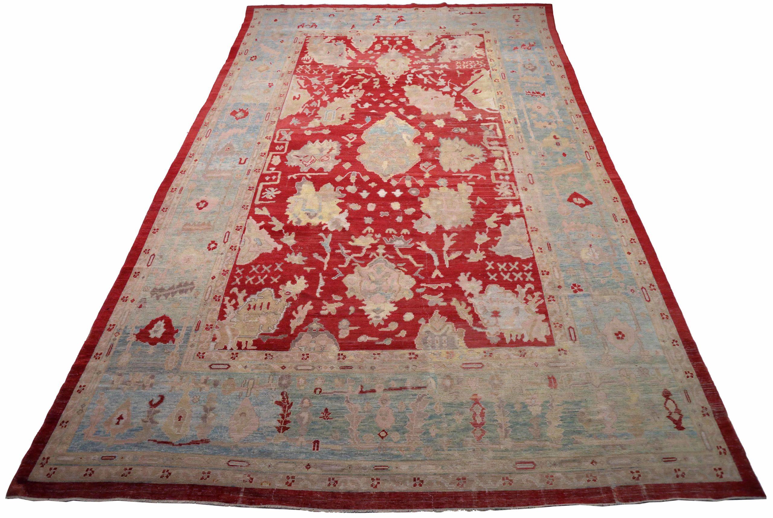 Entdecken Sie die Eleganz von Afghanistan Oushak mit einem übergroßen Teppich von CIRCA 1990. Dieses exklusive Design aus Wolle und Blau-Elfenbein-Rot ist perfekt, um Ihren Raum zu verschönern.