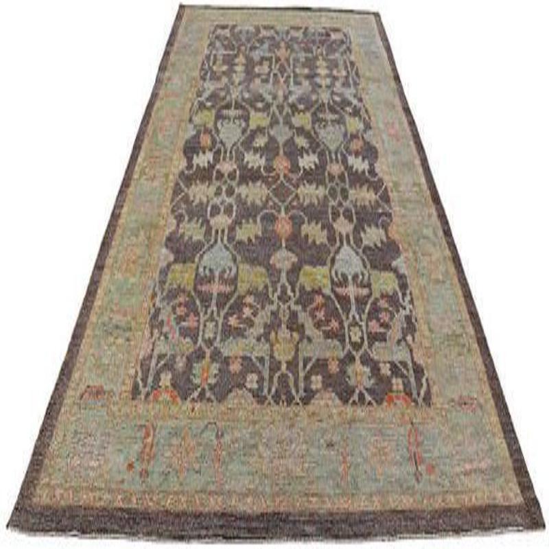  Tribal Turkish Wool Area Rug 

This extraordinary rug commands attention with its radiant, earthy palette and intricately scattered tribal motifs. Its robust construction and profound antique aesthetic provide an unyielding foundation of elegance