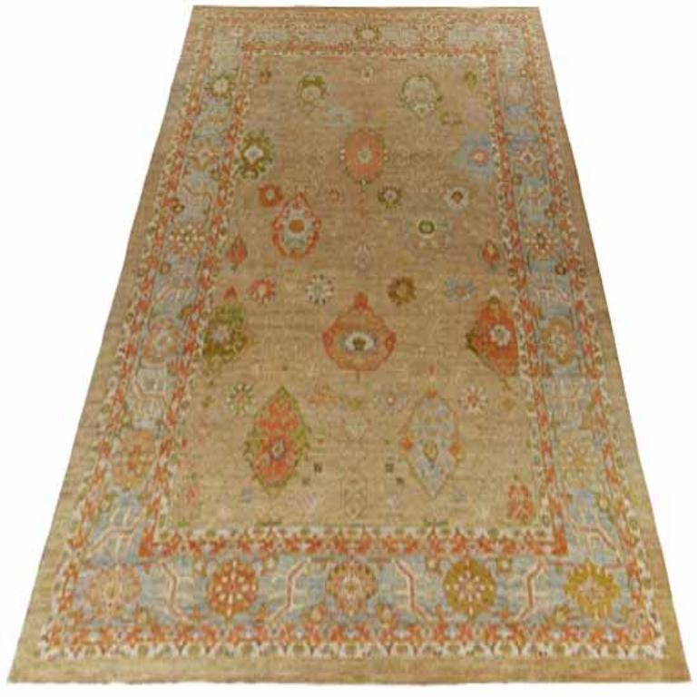 Entdecken Sie die Eleganz von Afghanistan Serapi mit einem übergroßen Teppich von CIRCA 1990. Dieses exklusive Design aus Wolle und BlauGrünElfenbeinRot eignet sich perfekt, um Ihren Raum zu verschönern.