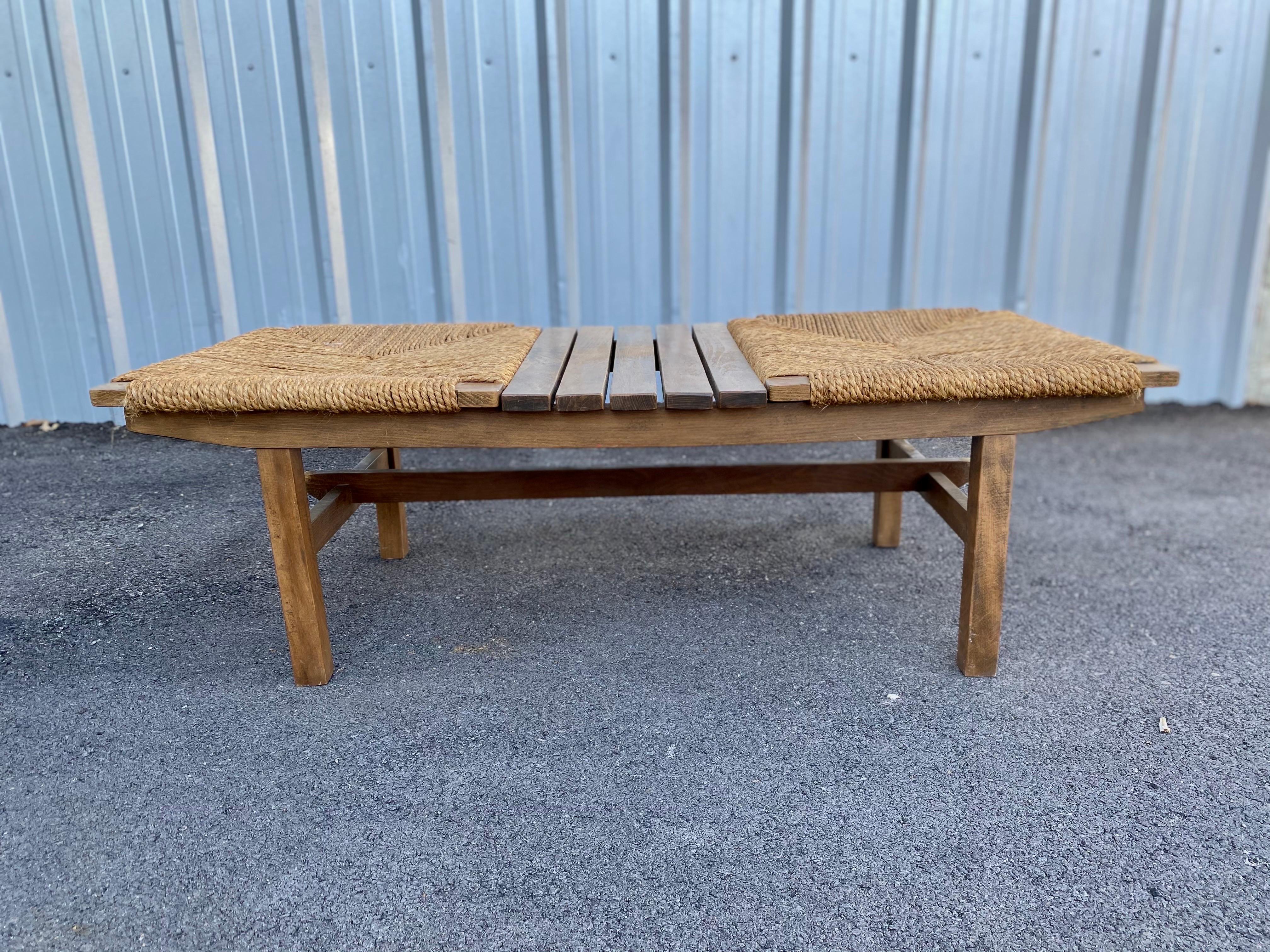 Beautiful minimalist AFM Quality Furniture Japanese modernist slat bench with a rush seat is made of walnut, circa 1960s, Japan. Similar to Scandinavian modern design, Japanese design has the same clean lines that are simple, understated, and