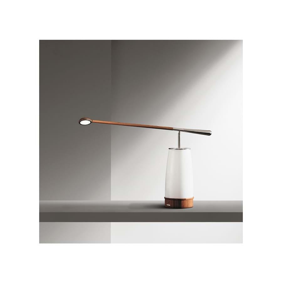 Table and reading lamp with the structure in solid polished pau Ferro and brushed nickel-plated metal protection.
In Afo the static concept is completely overcome by the directional head and by the stem which can be regulated both horizontally and