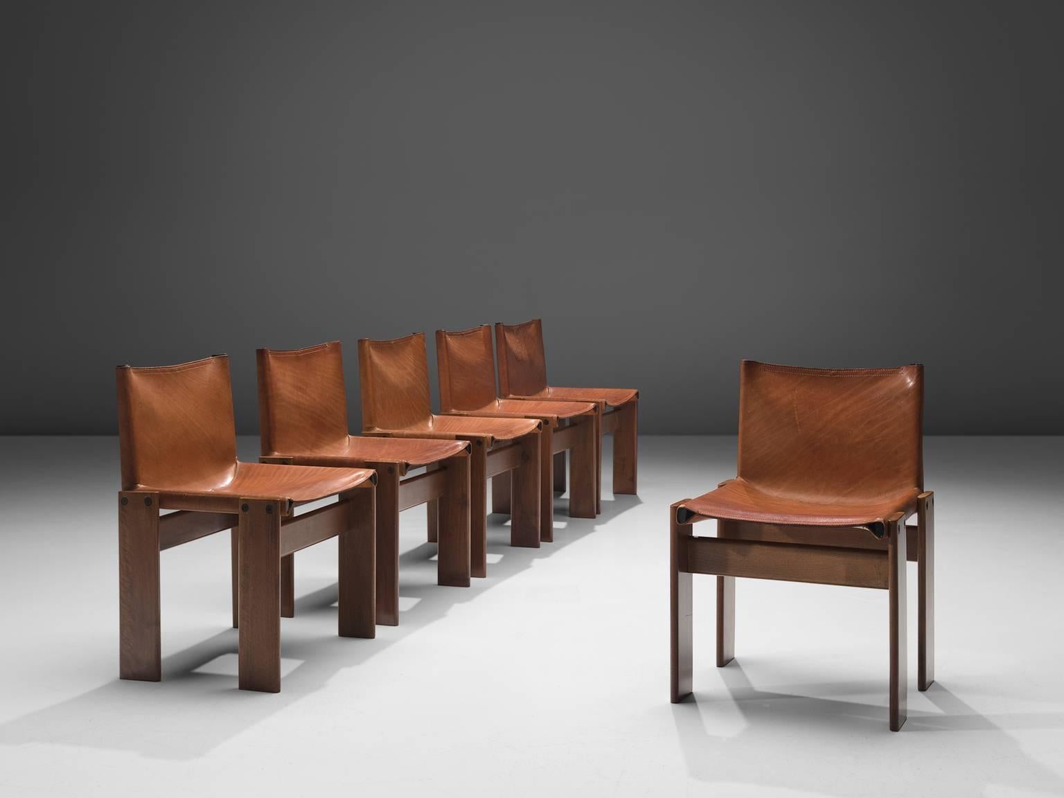 Afra & Tobia Scarpa, six monk dining chairs, wood and patinated cognac leather, Italy, 1974.

The wonderfully patinated cognac leather forms a striking combination with the dark walnut wood. Interesting is the 'flat' shape of this chair where the