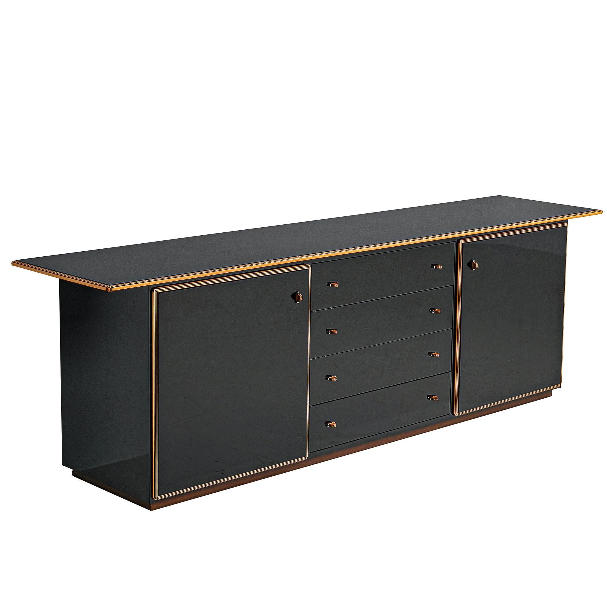 Afra and Tobia Scarpa for Maxalto, 'Artona' cabinet, walnut and four leather doors, Italy, circa 1975.

This sideboard with black lacquered drawers, doors and top is designed as part of the Artona line by the Scarpa duo was in fact the first line