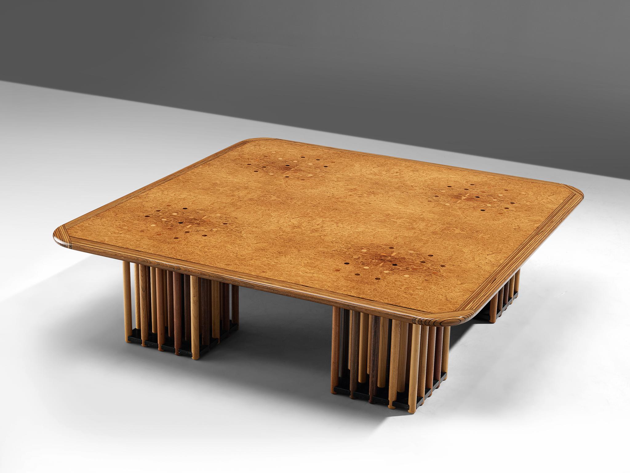 Afra and Tobia Scarpa, 'Artona' coffee table, maple burl, birch, beech, oak and fruitwood, Italy, circa 1975.

Every detail about this design is extraordinary. The square coffee table features four feet that exist out of circular rods. The