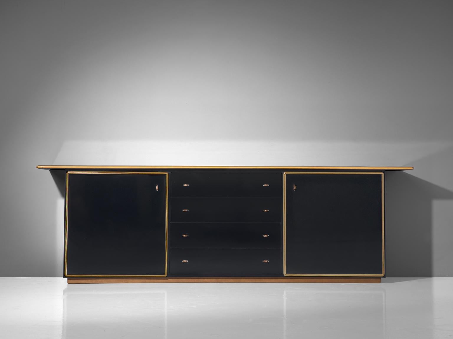 Afra & Tobia Scarpa, Artona cabinet, walnut and four leather doors, Italy, circa 1975

This sideboard with black lacquered drawers, doors and top is designed as part of the Artona line by the Scarpa duo was in fact the first line ever produced by