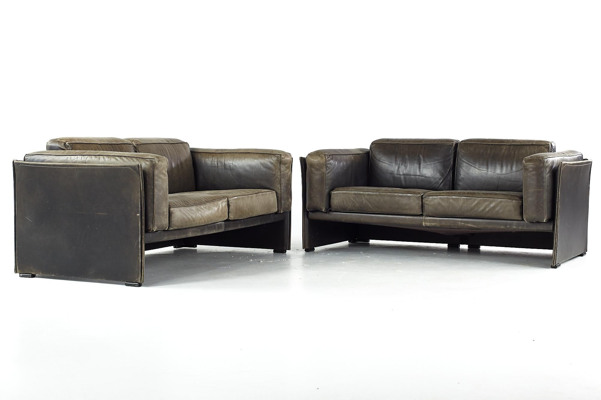 Afra and Tobia Scarpa for Cassina midcentury italian leather sofas - pair.

Each sofa measures: 64 wide x 32.5 deep x 27 inches high, with a seat height of 16 and arm height of 24.5 inches

All pieces of furniture can be had in what we call