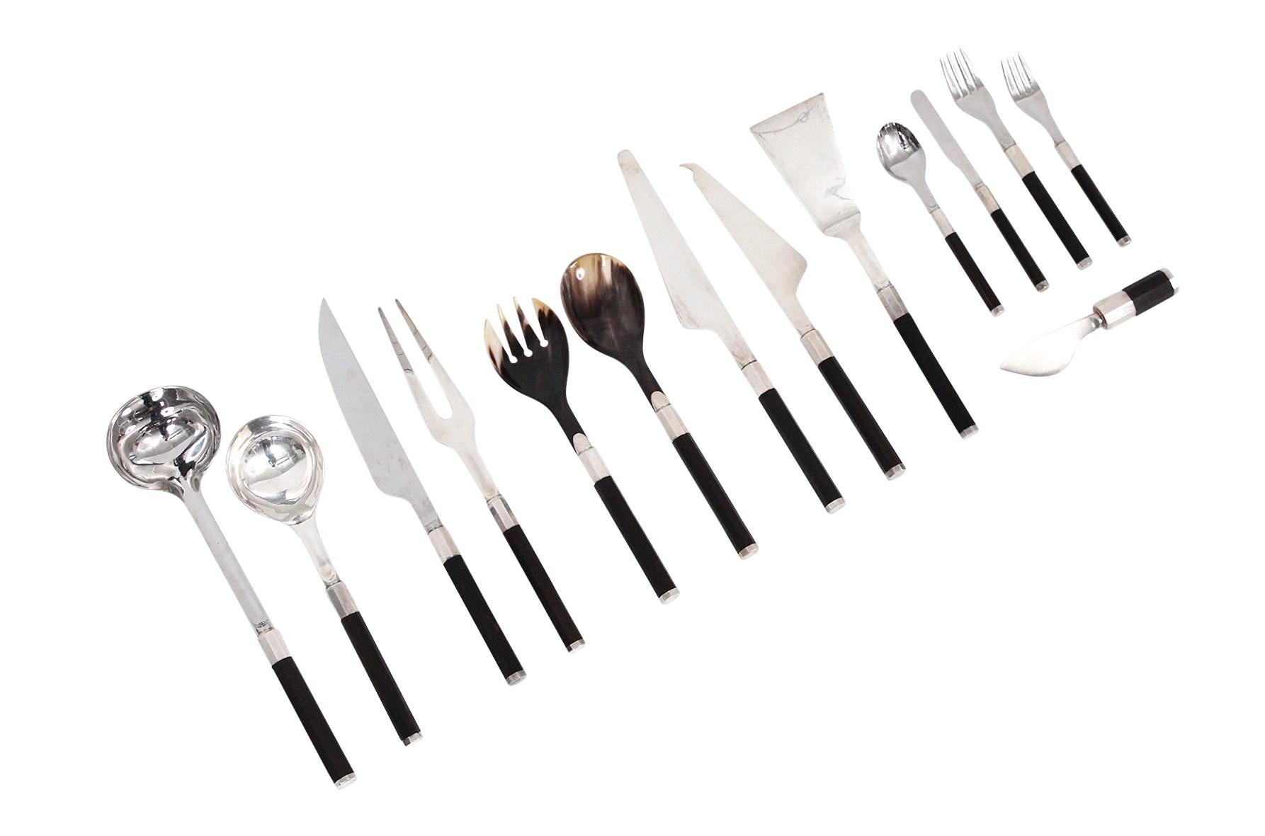 Rare and extensive grouping of 14 pieces of flatware designed by Afra and Tobia Scarpa for San Lorenzo studio, circa 1975. This pattern is executed with exotic wooden handles, sterling, and Horn. Crafted by master silversmith Ciro Cacchione. San