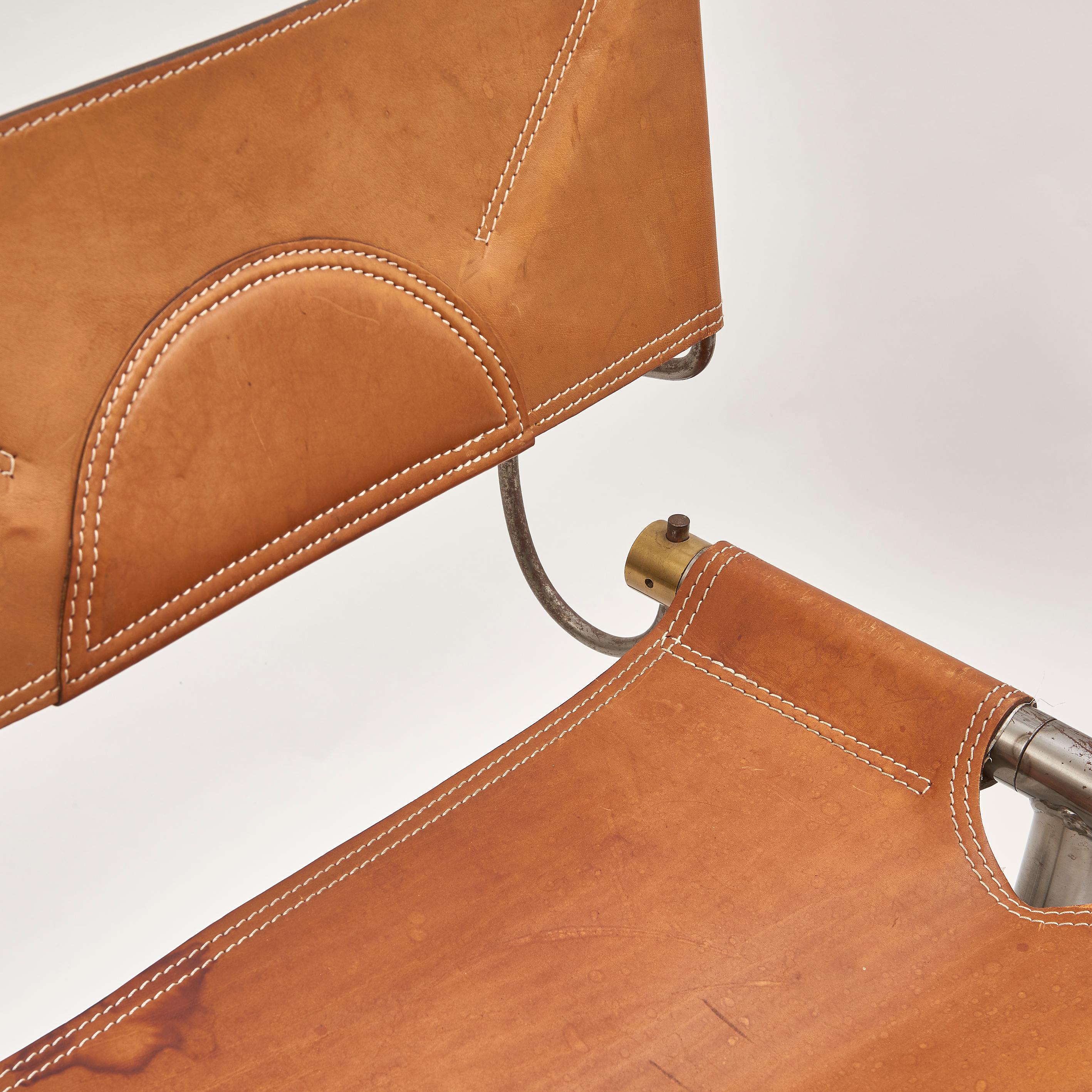 A pair of iconic, custom steel, brass and original leather chairs, by Afra and Tobia Scarpa, circa 1985, which were designed for the Benetton Headquarters, circa 1985. This architecture and design duo are internationally renowned, and original